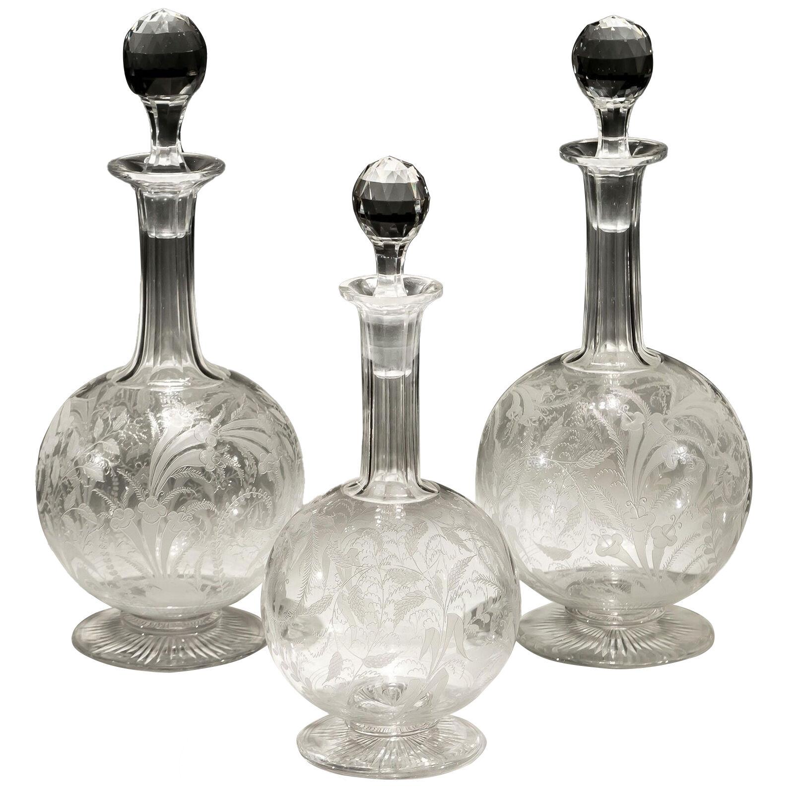 A SUITE OF FINALLY ENGRAVED DECANTERS