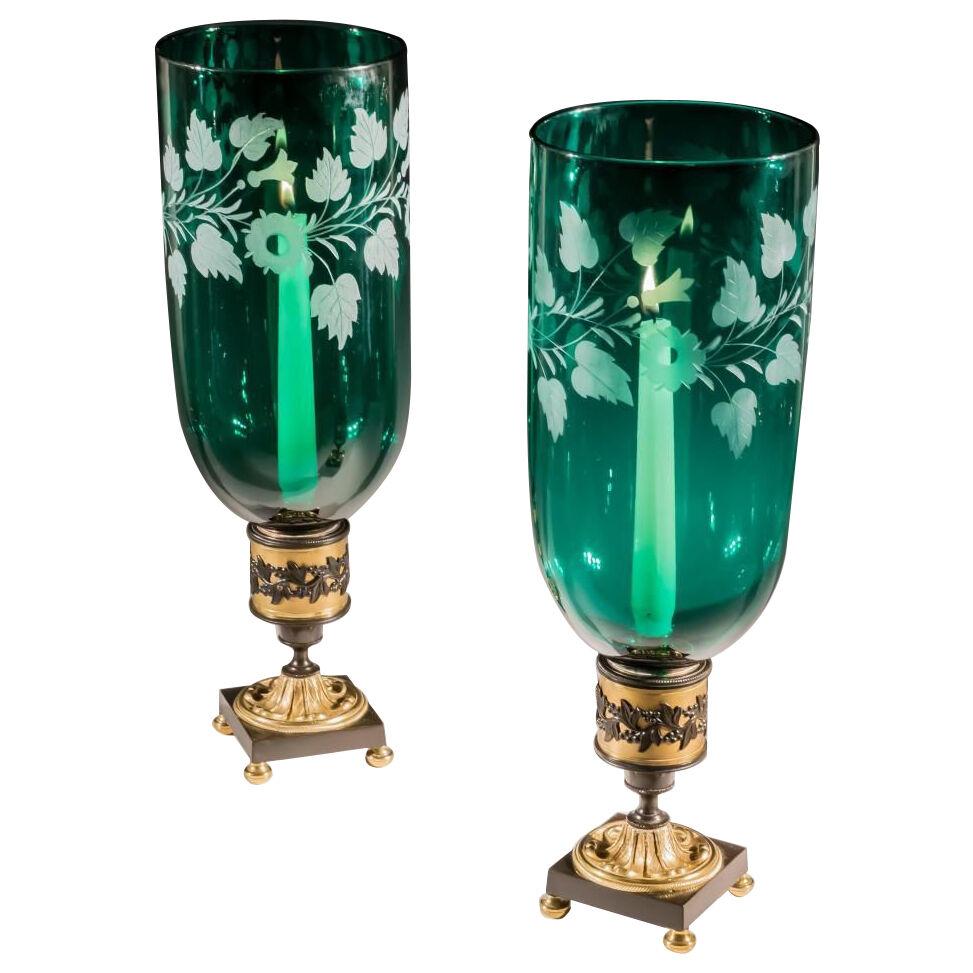 A PAIR OF ORMOLU & BRONZE MOUNTED GREEN STORM SHADES