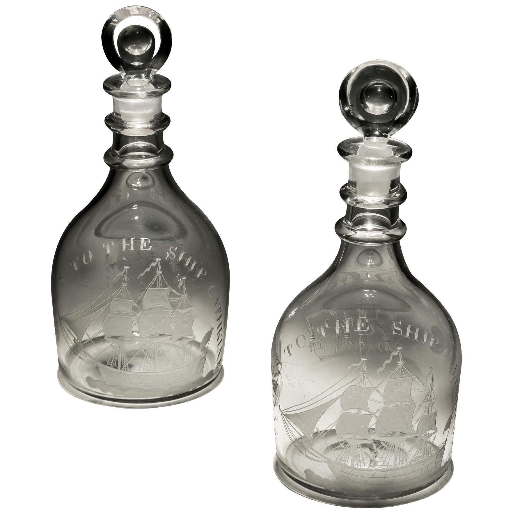 A PAIR OF GEORGIAN DECANTERS OF NAUTICAL INTEREST