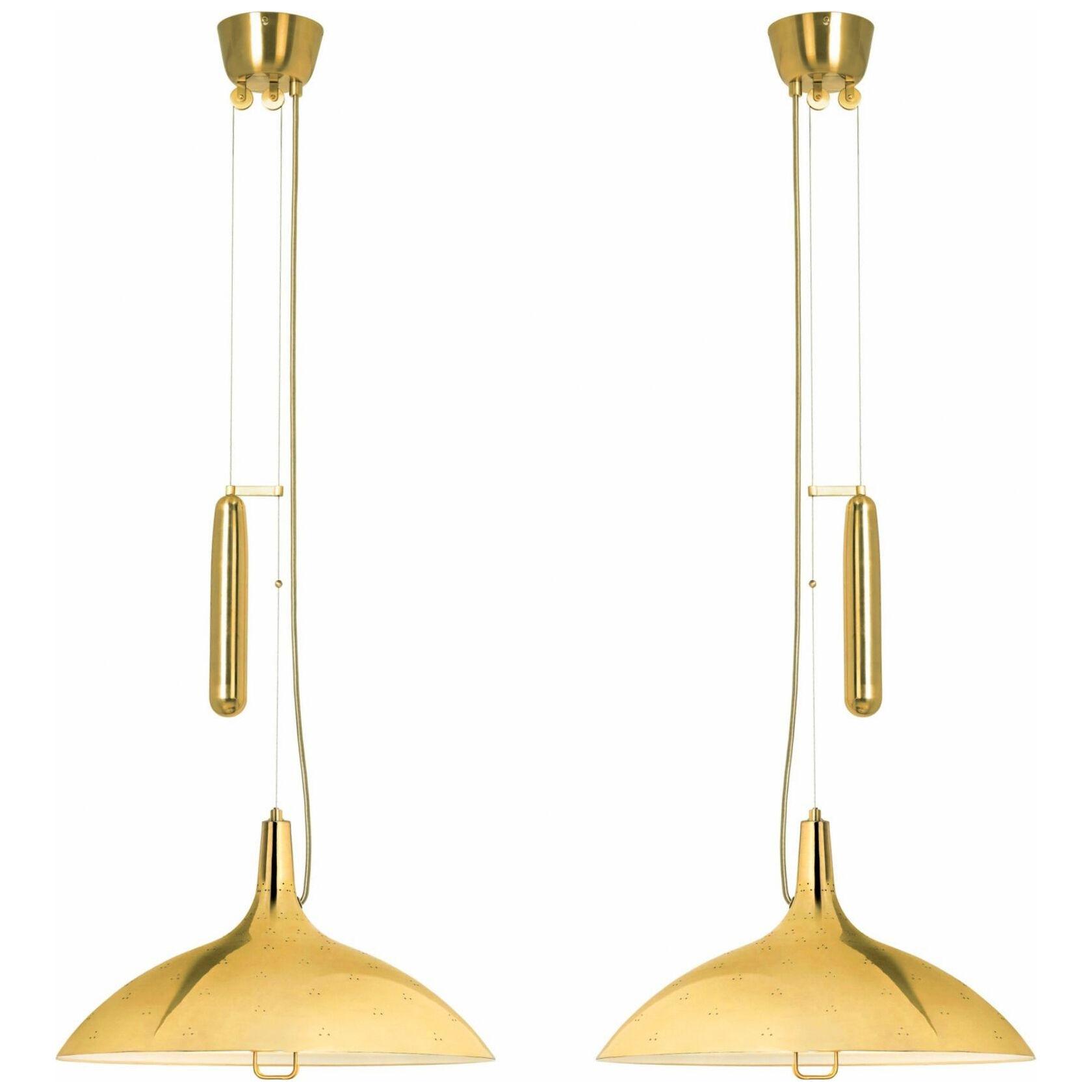 Pair of Counterbalance ceiling lamps, model 10202 by Paavo Tynel