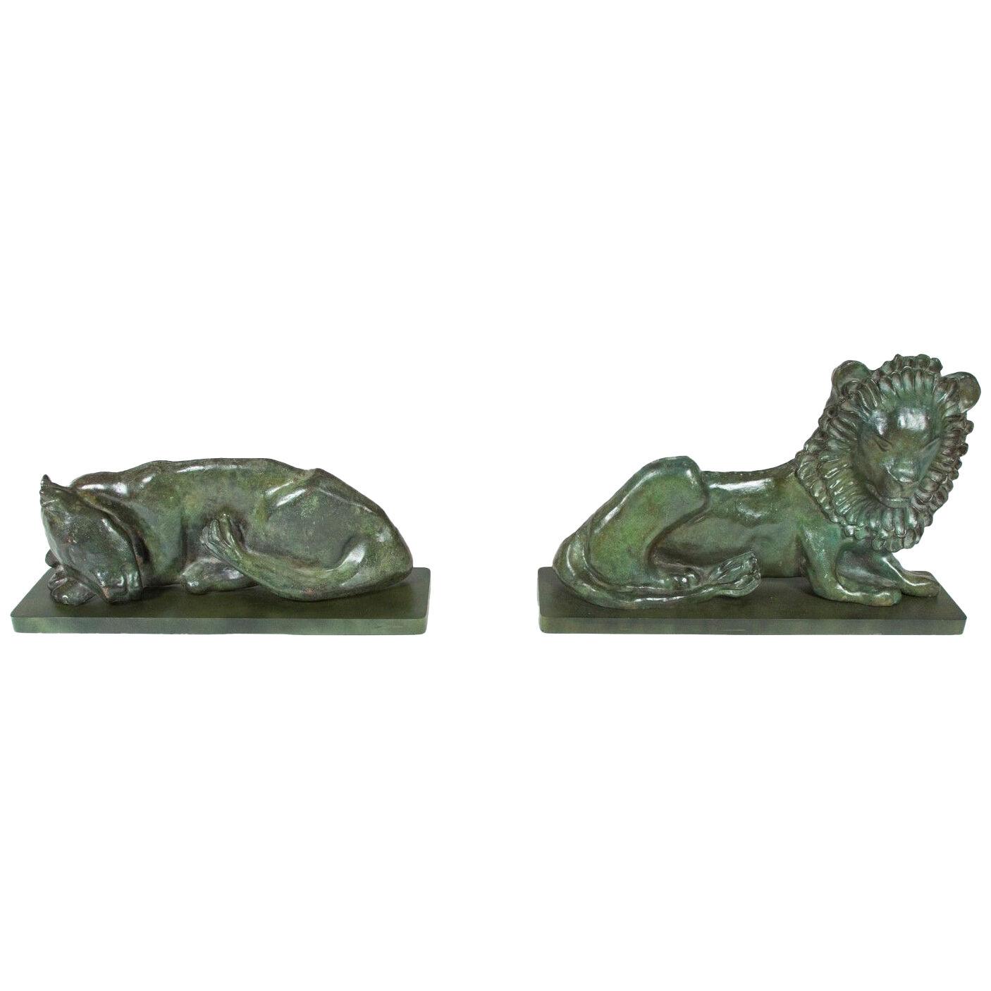 Bronzes of a Lion and sleeping Lioness