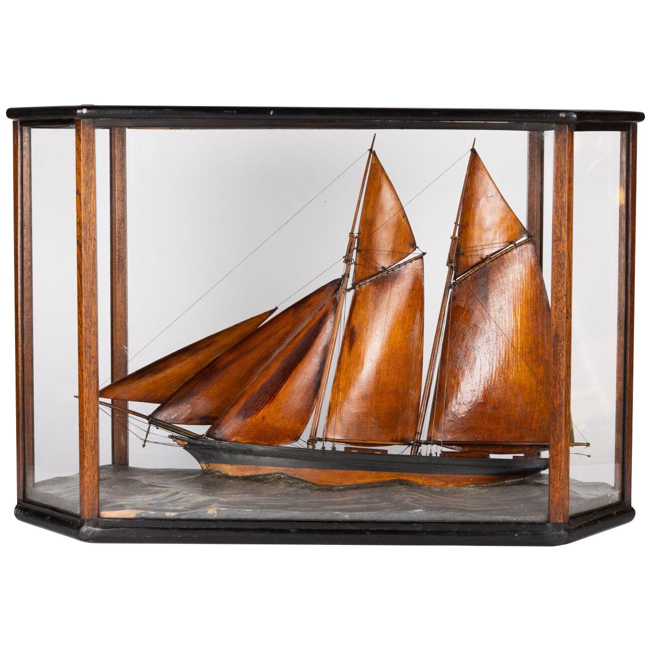 Diorama of a finely carved Ketch sailing at sea