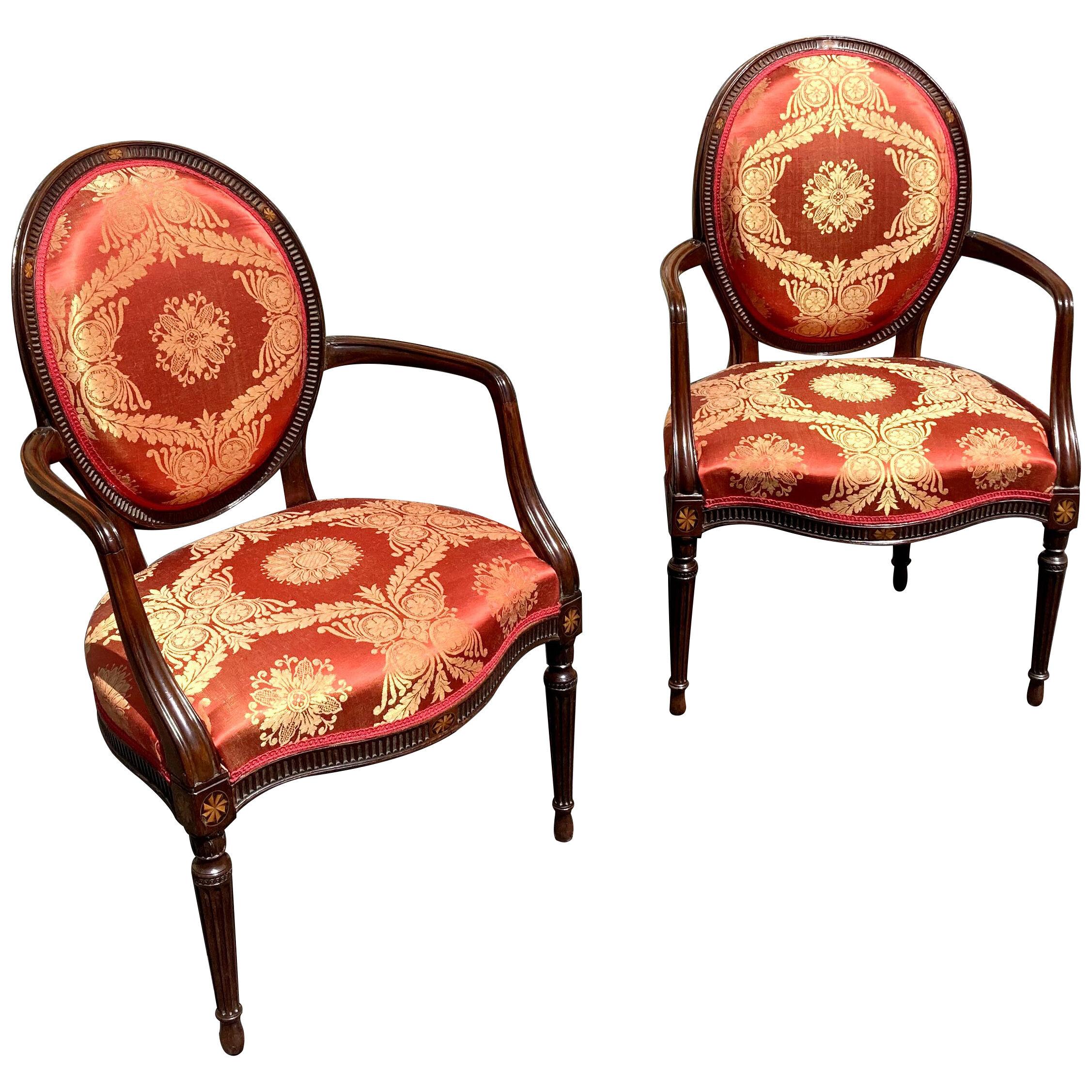 A pair of George III mahogany armchairs in the manner of John Linnell