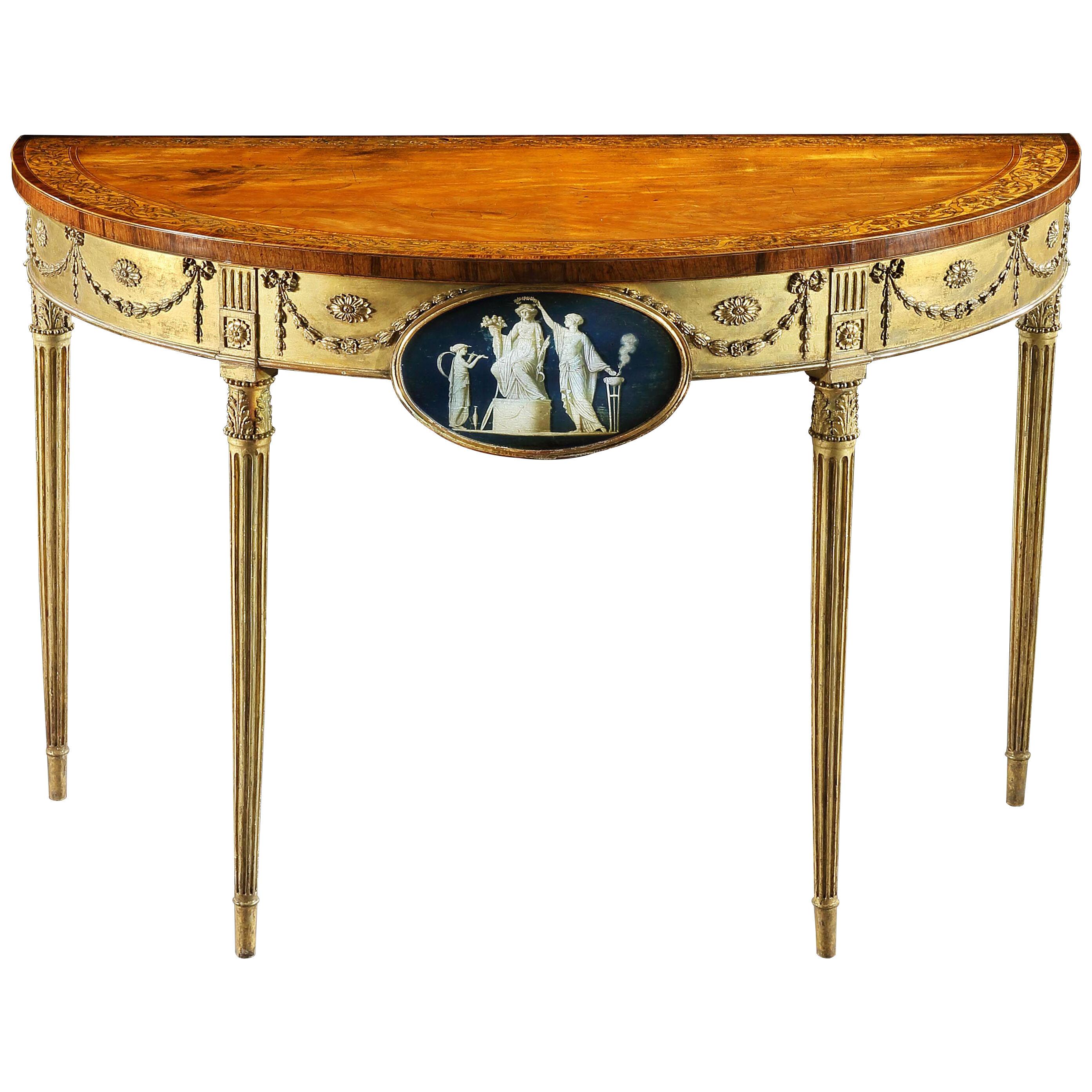 A George III Satinwood Marquetry Giltwood and Composition Demi-Lune Table