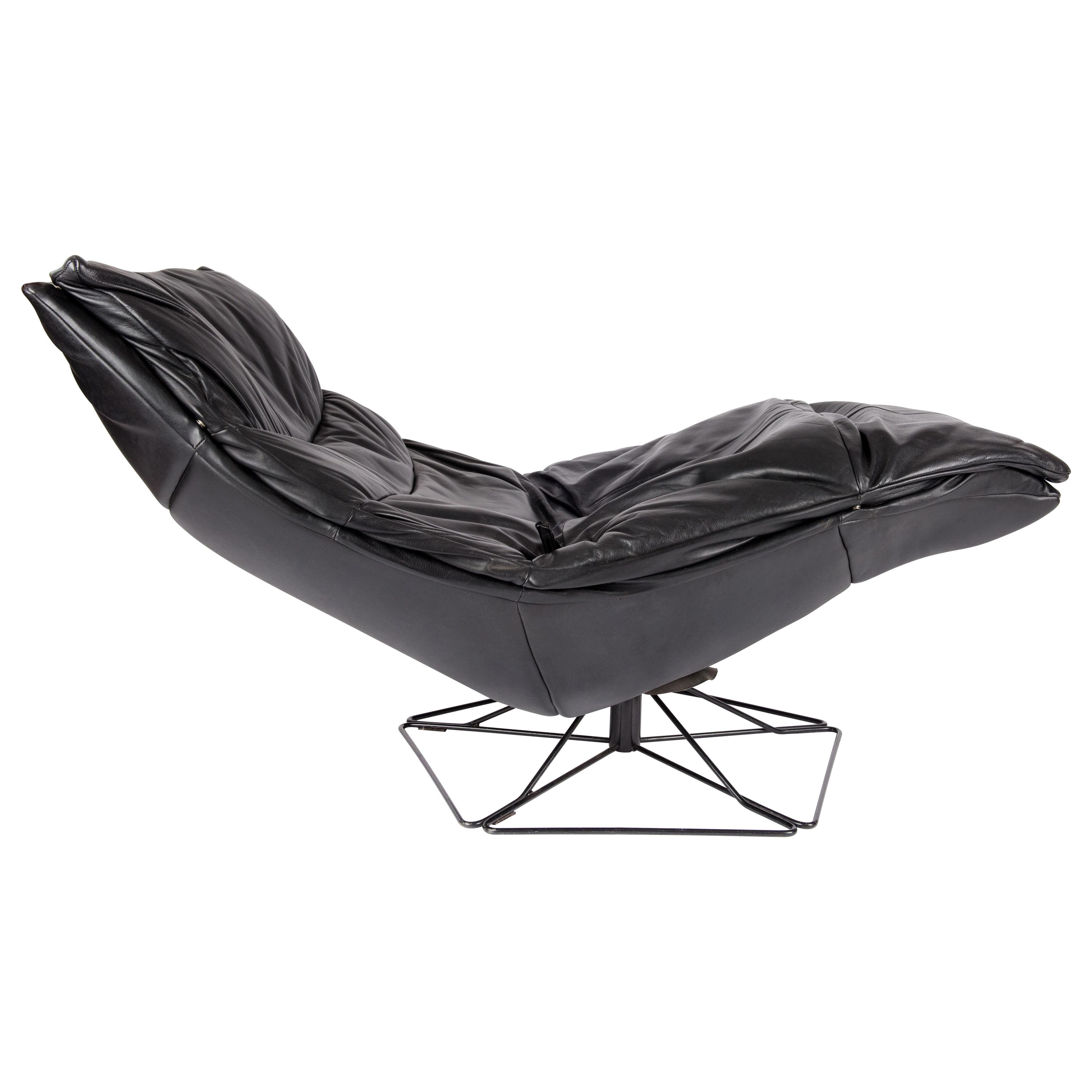 Mid -century design black leather swivel chair