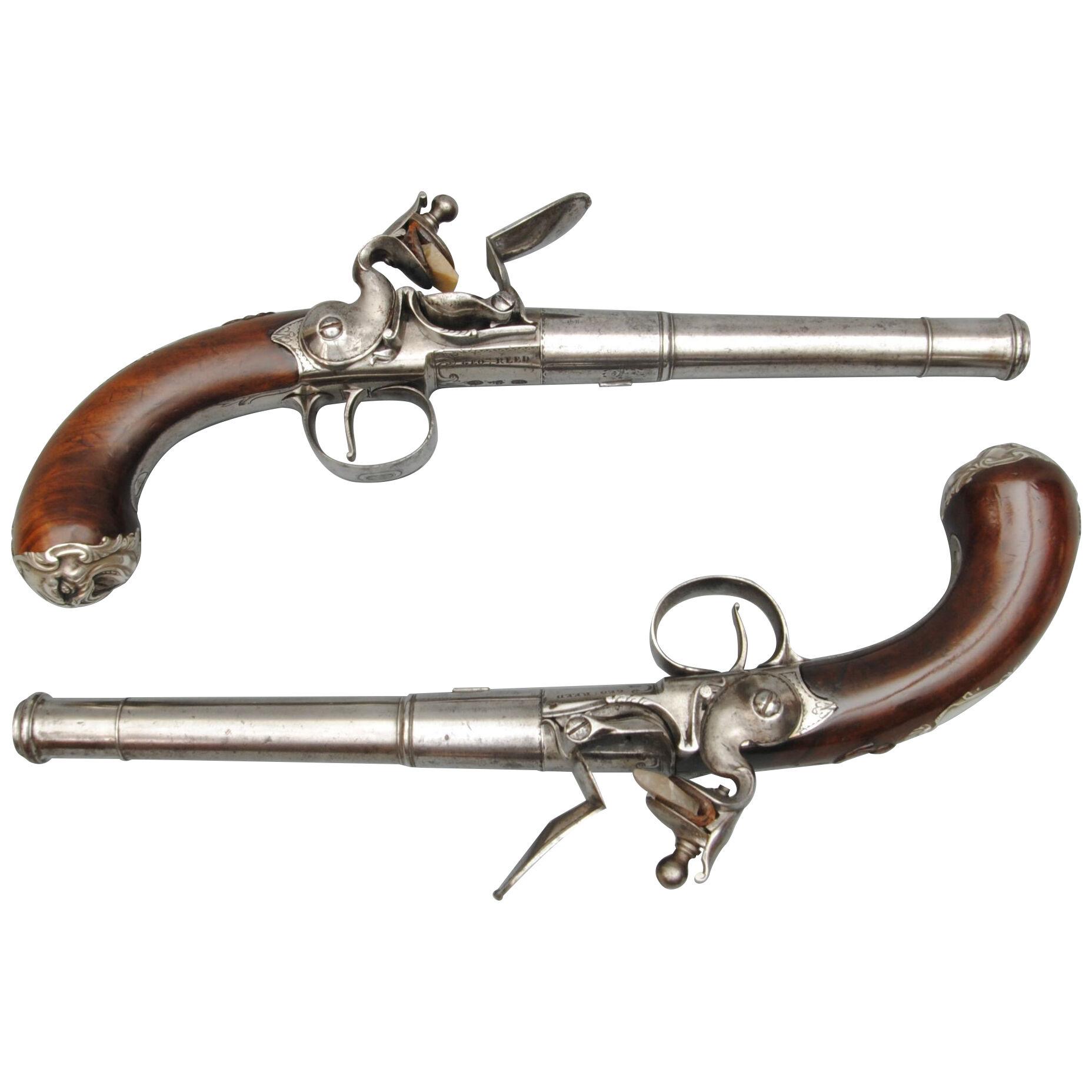 A RARE PAIR OF SILVER MOUNTED QUEEN ANNE PISTOLS