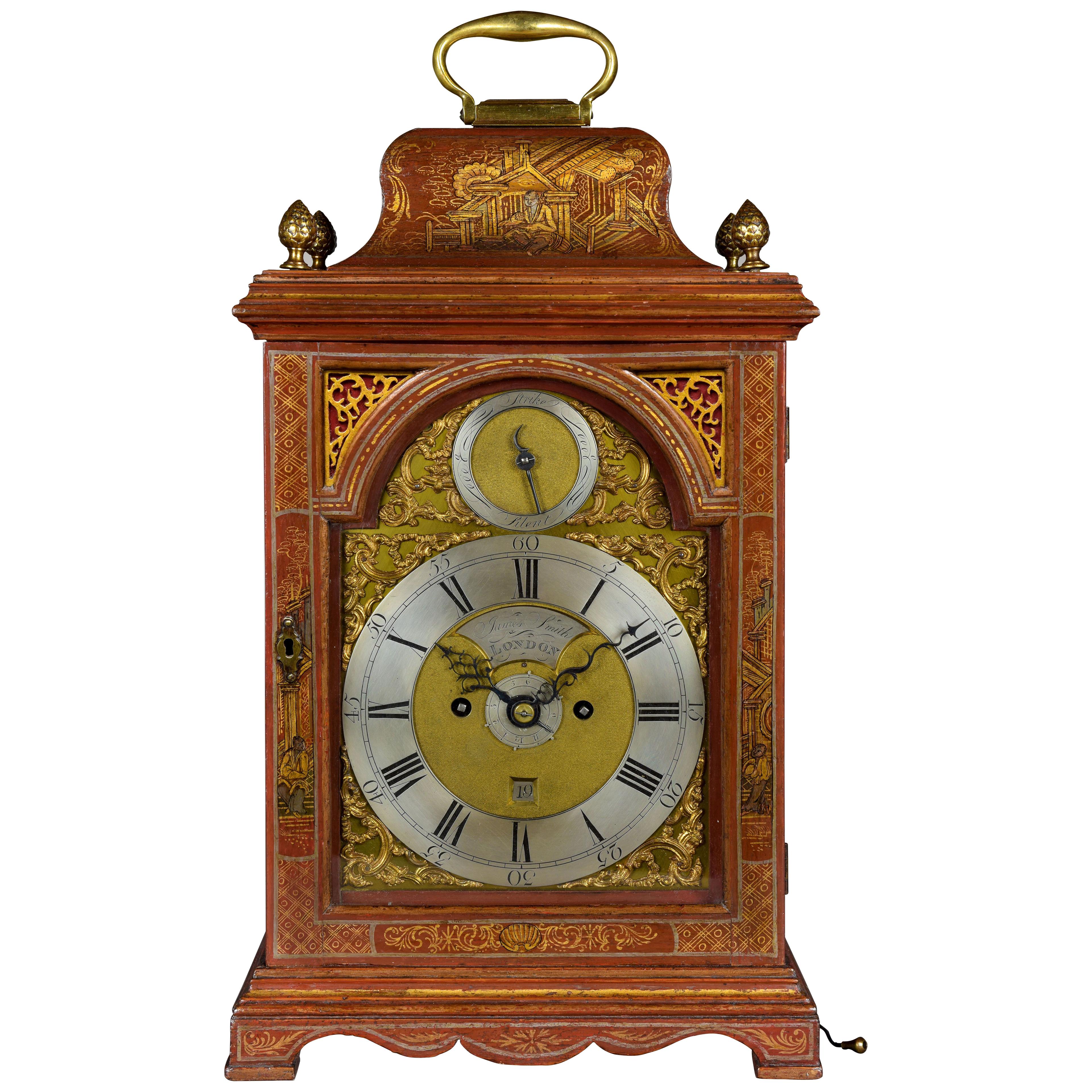 JAMES SMITH, London. A FINE GEORGE III PERIOD RED LACQUER ALARM TABLE CLOCK.