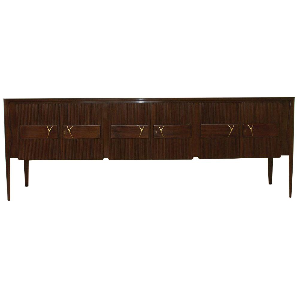 Large Mid Century Modern Italian sideboard with green glass top.