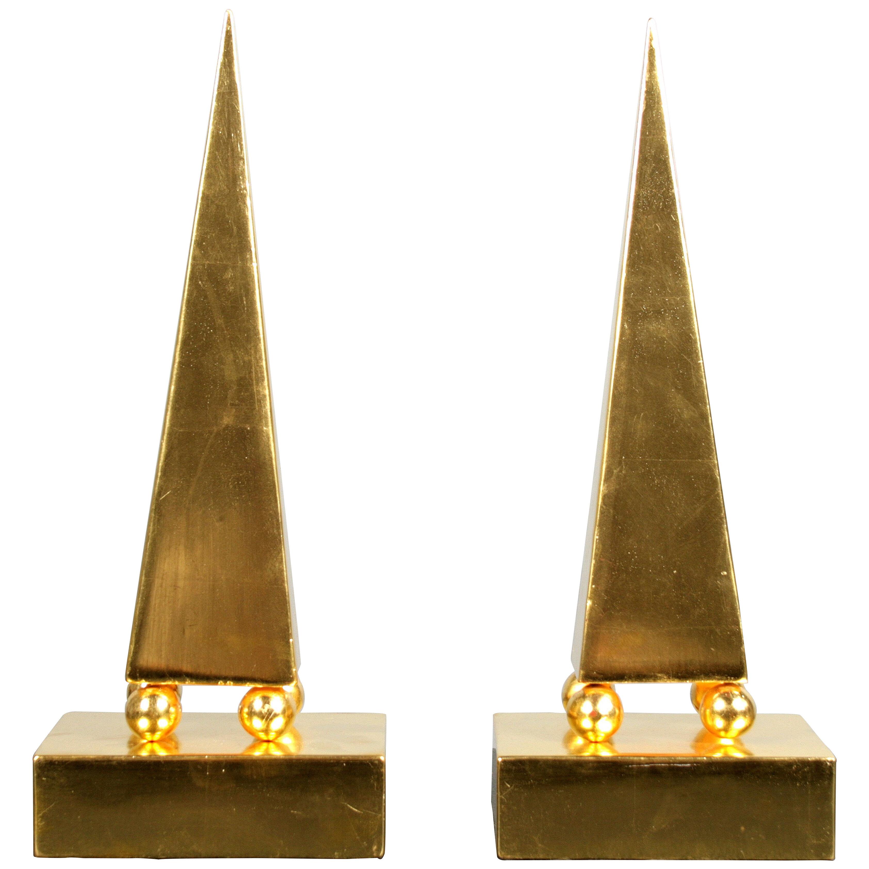 Pair of giltwood obelisks by Fornasetti