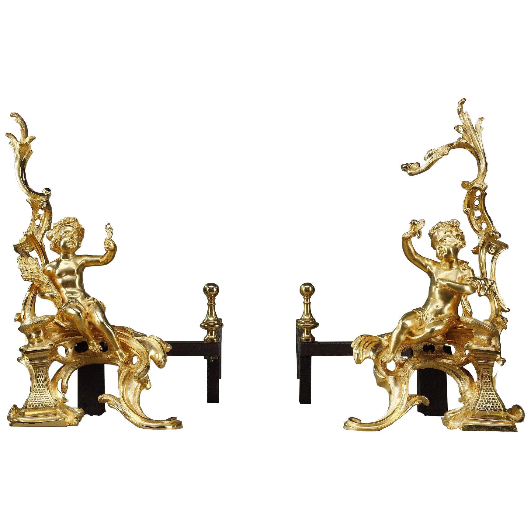 Pair of gilded bronze andirons in Louis XV style