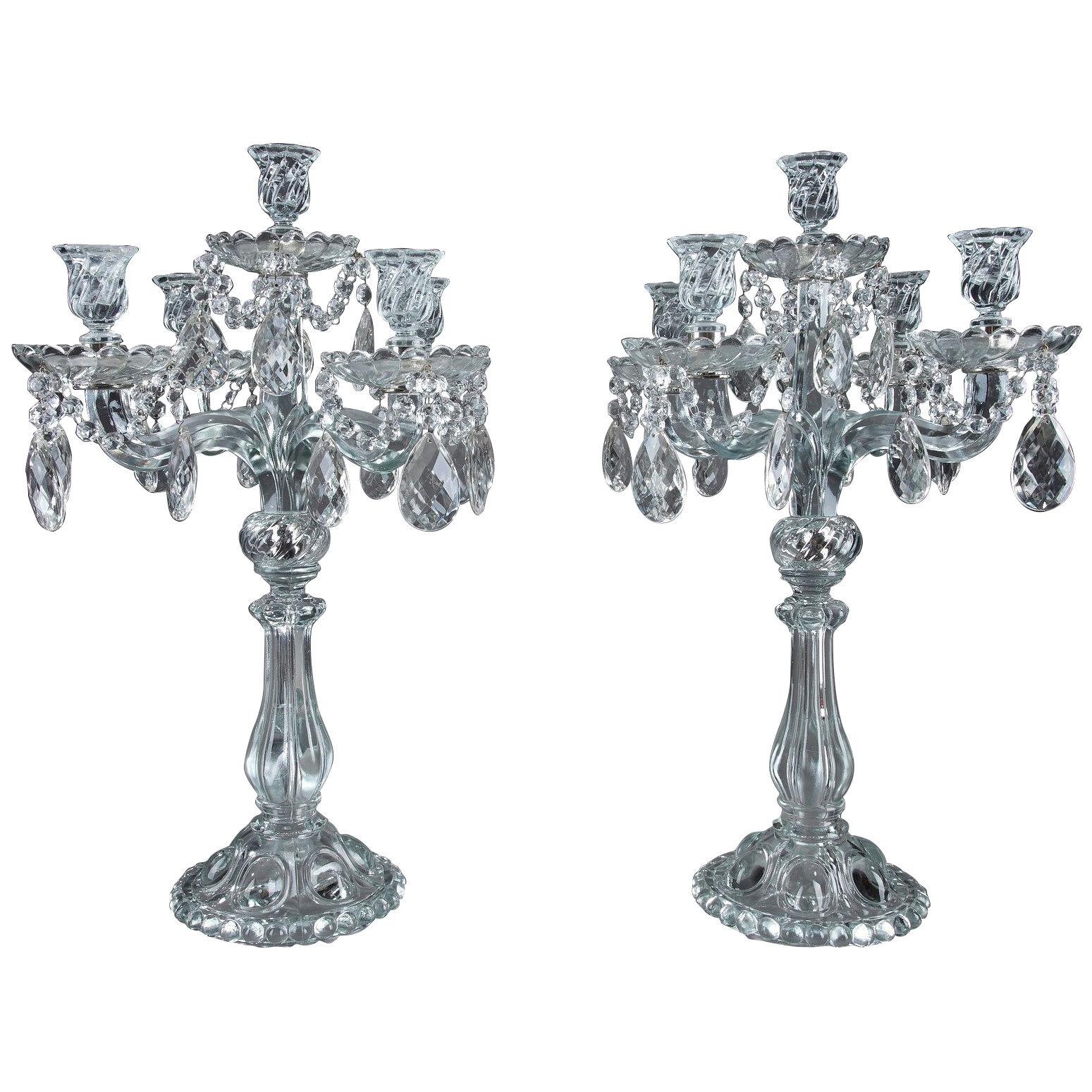Pair of glass candelabras with crystal pendants