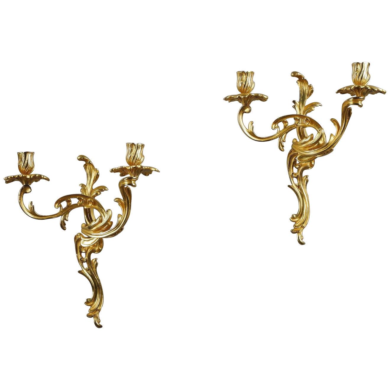 Pair of gilt bronze wall candlesticks in rocaille style