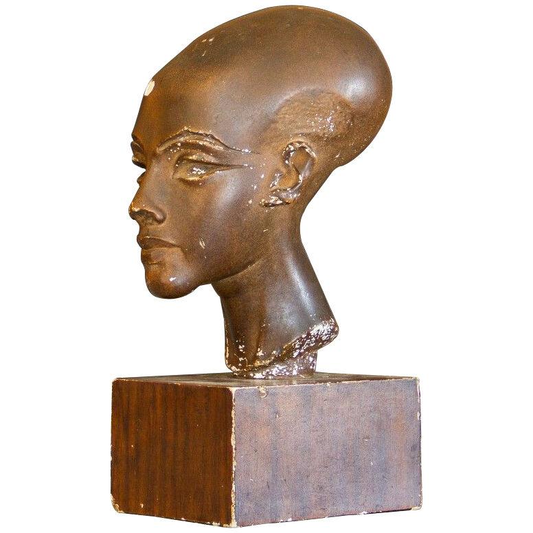 A Danish patinated plaster sculpture of an Egyptian stylised head