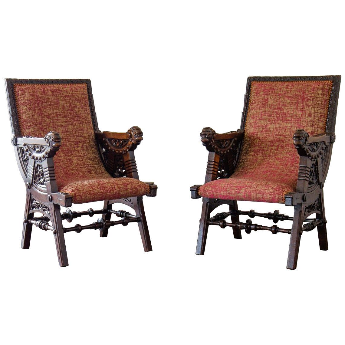 A Pair of late 19th Century French Carved Walnut Armchairs