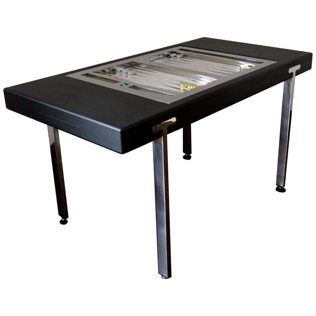 An Ebonised and Nickel Tilt Top Backgammon Table