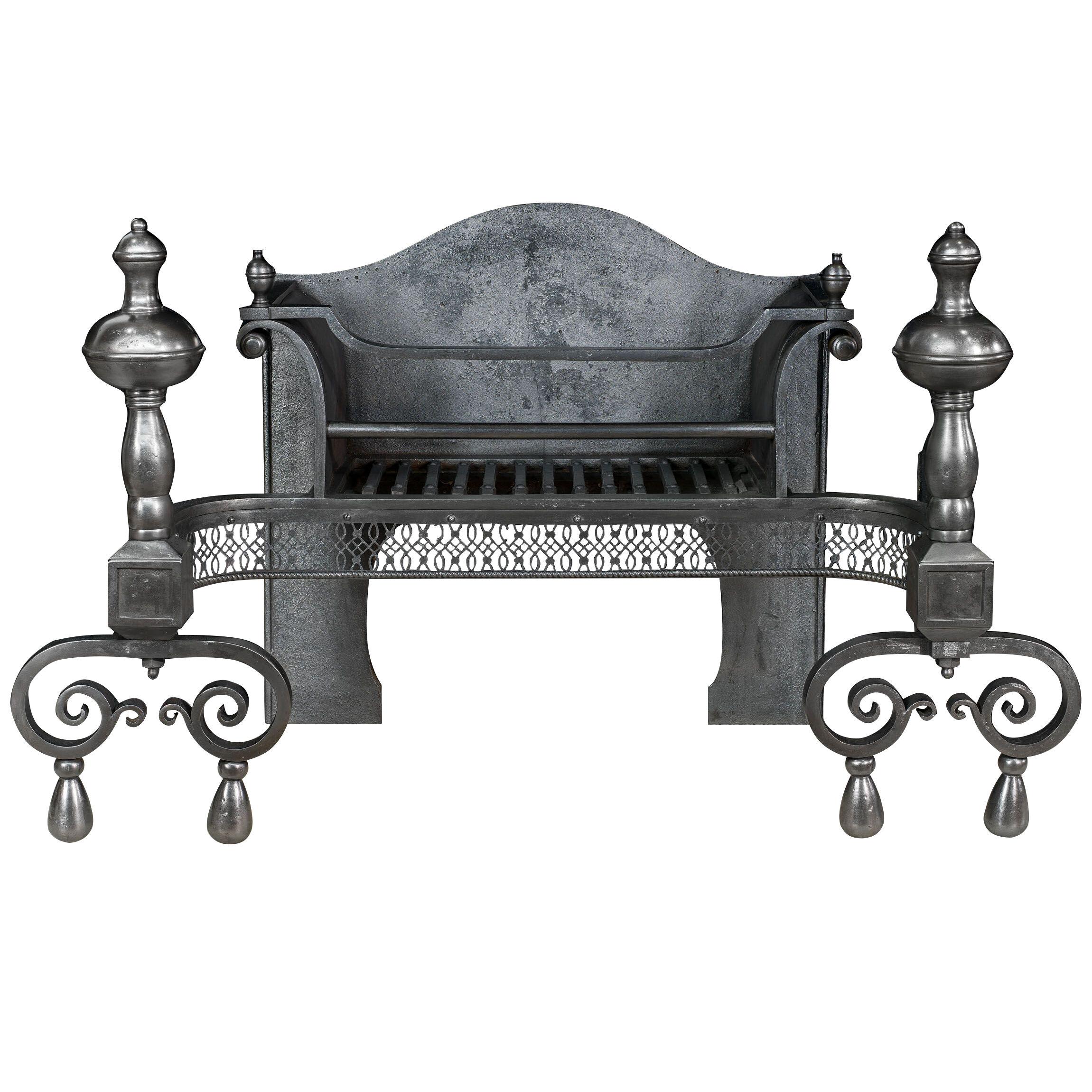 A Victorian steel and cast iron fire basket