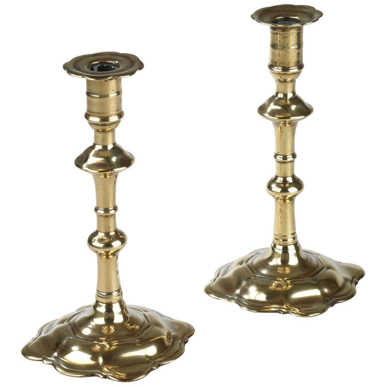 Pair of Georgian petal base brass candlesticks