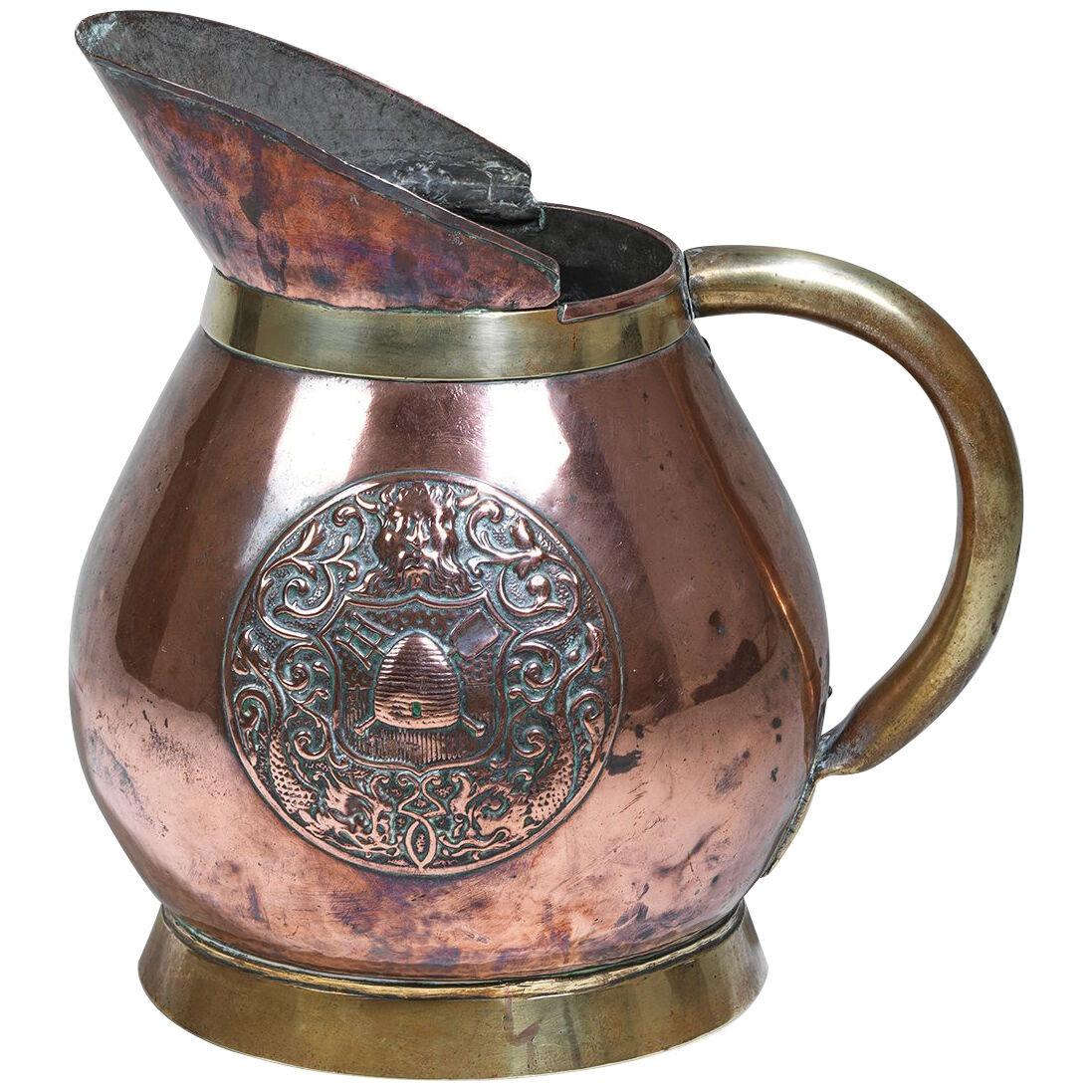 Nineteenth Century brass and copper ale jug
