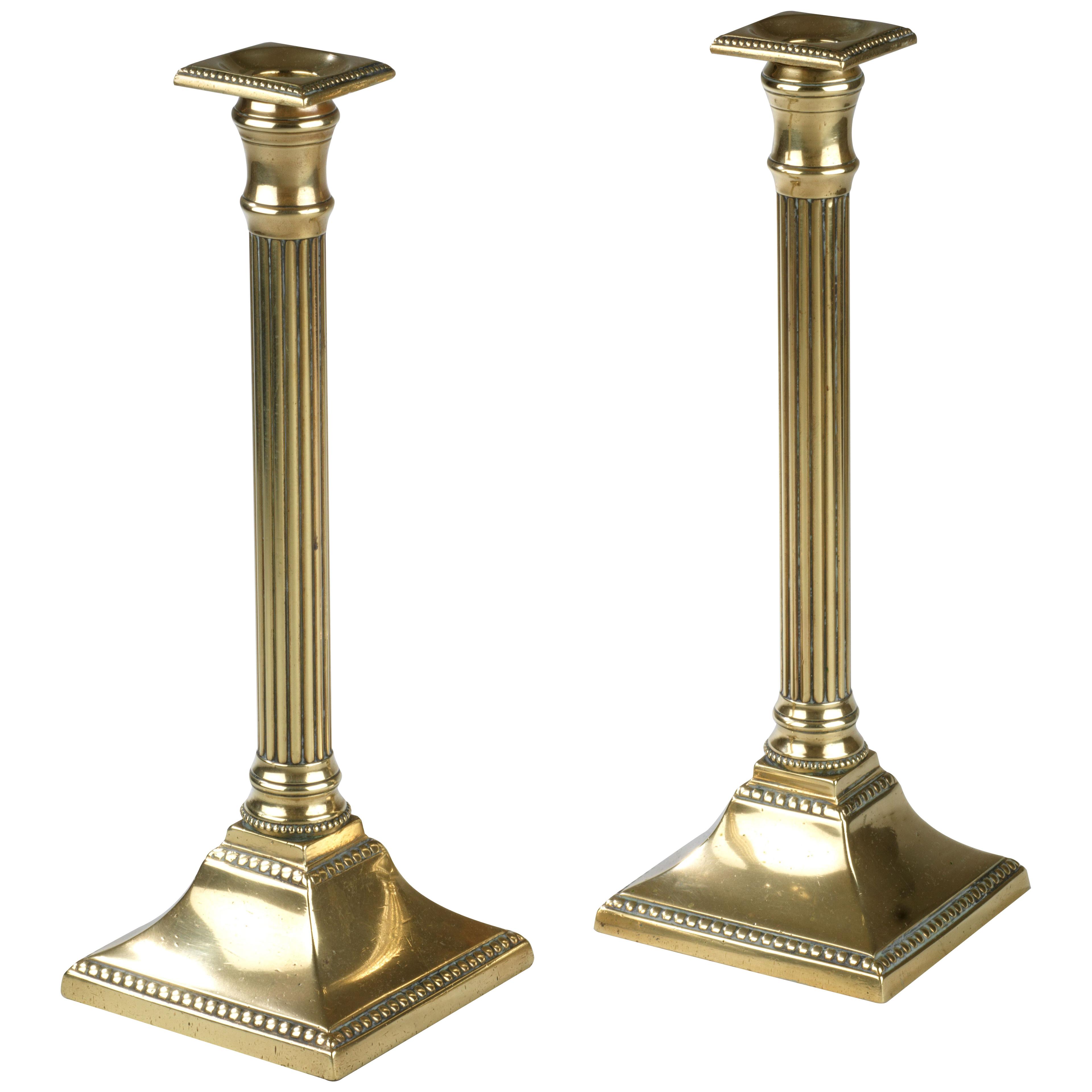 Pair of Georgian Neoclassical brass candlesticks