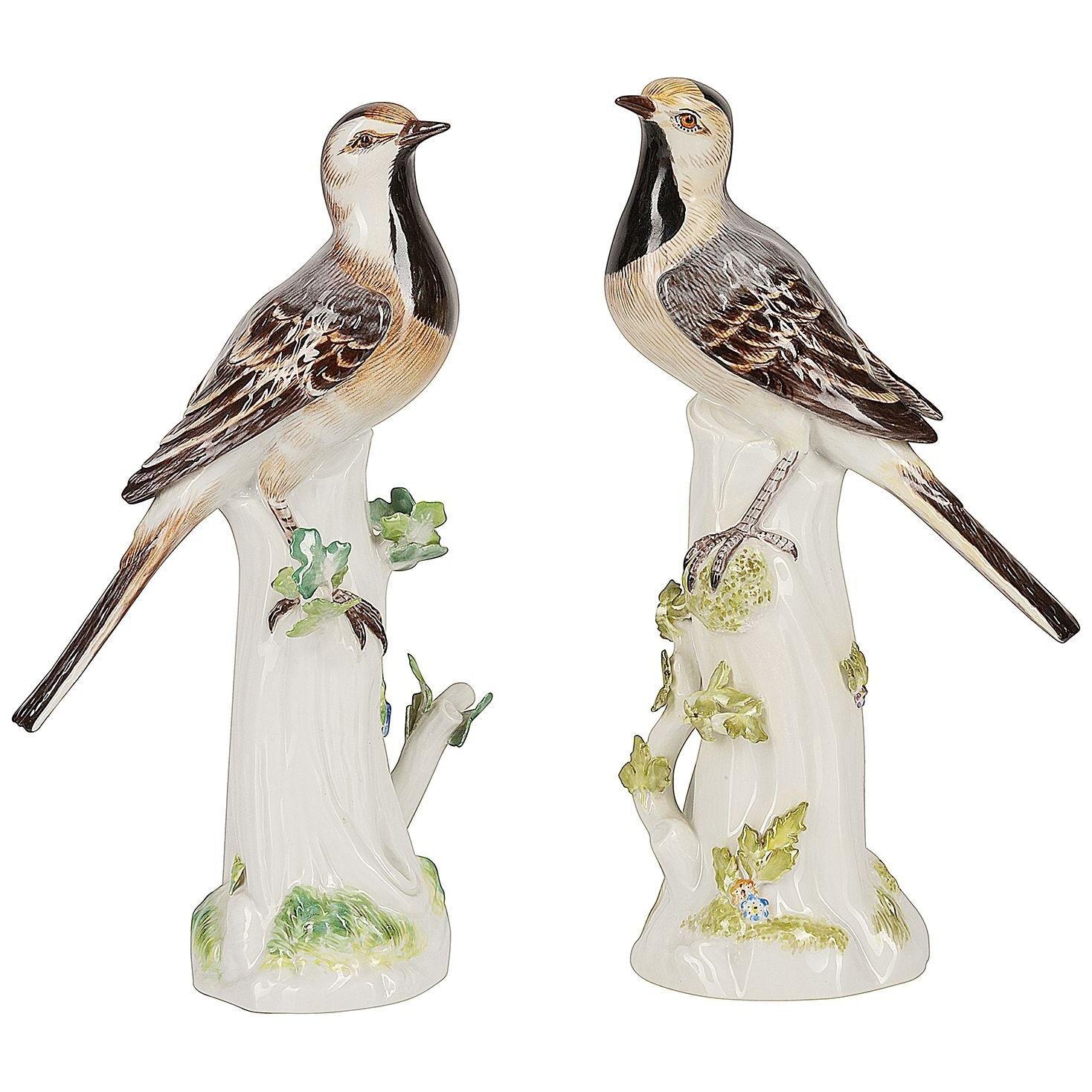 Pair Meissen porcelain Wag tails, perched on a tree stump, circa 1900