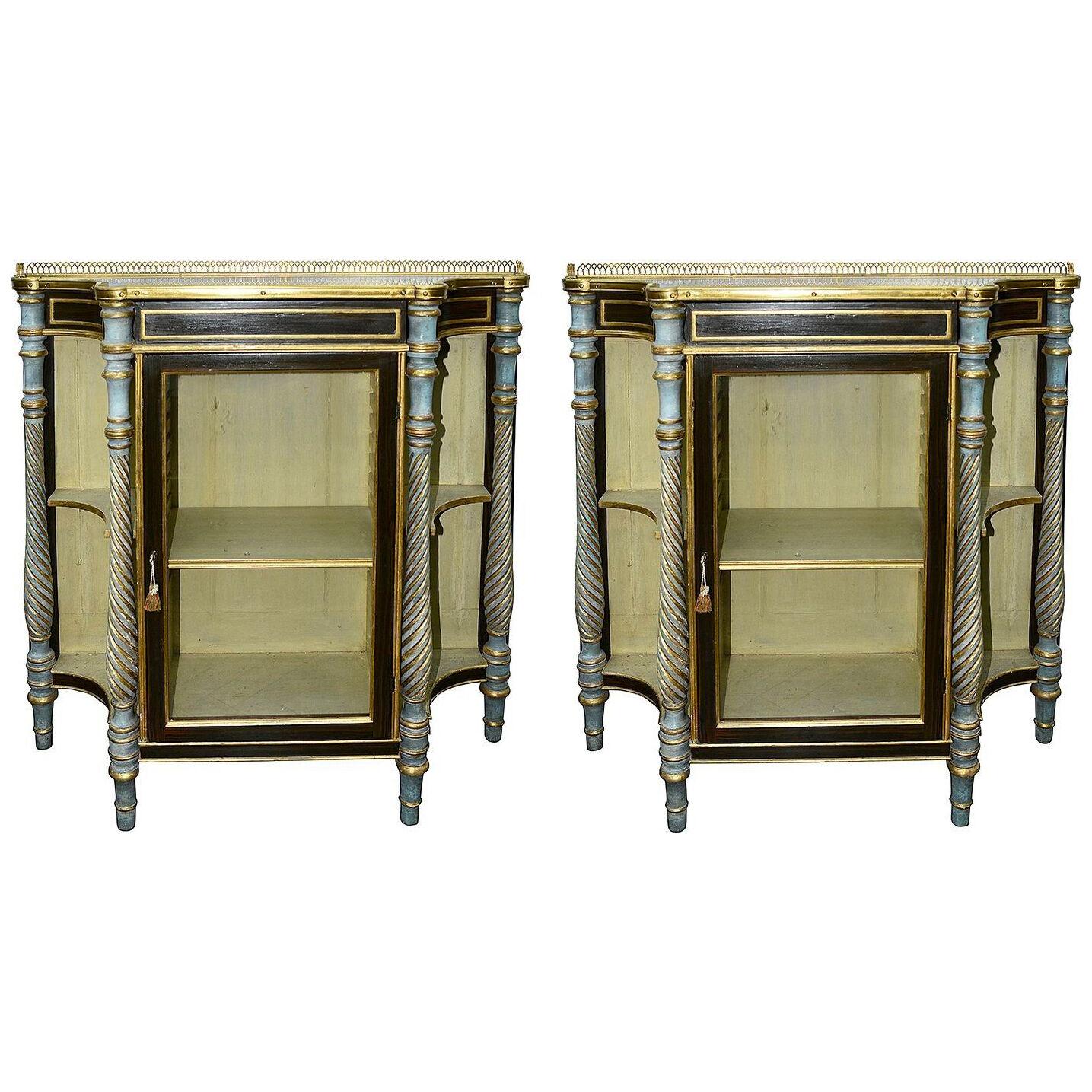 A pair of Regency paint decorated and giltwood side cabinets, circa 1820