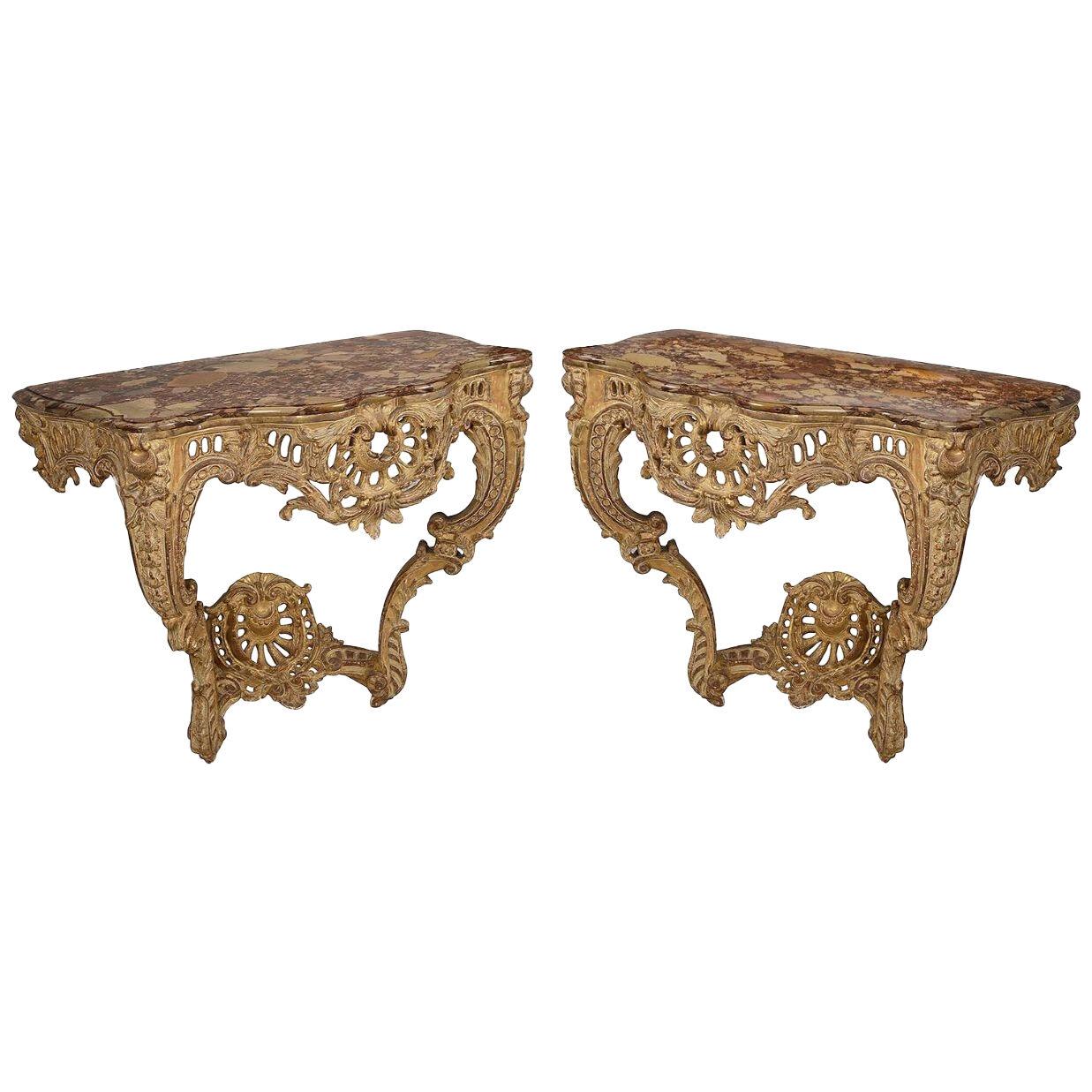 Pair French 18th Century carved giltwood marble topped console tables.