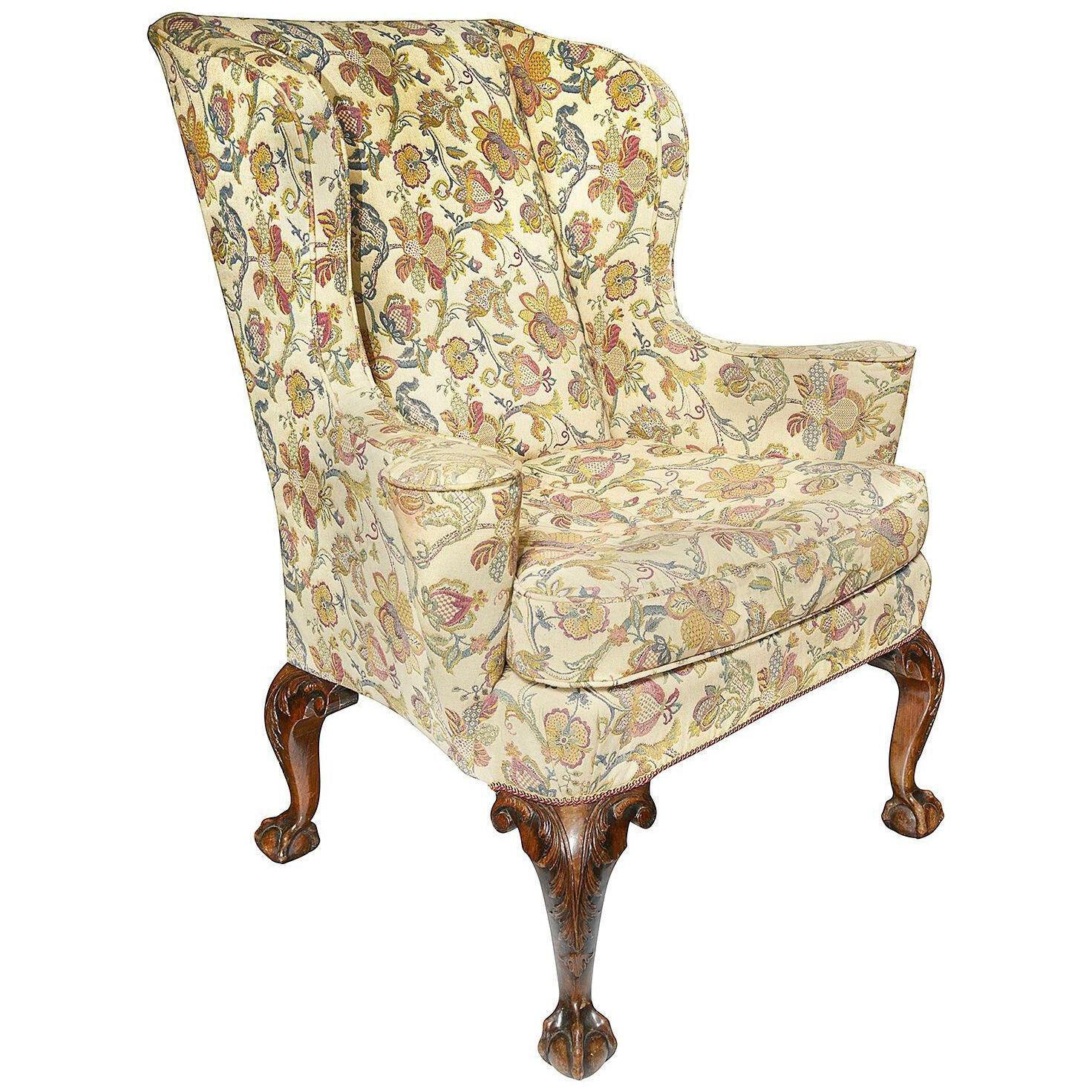 A George II style walnut wingback armchair