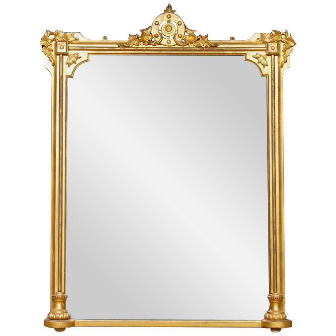 An Etruscan Revival giltwood overmantle mirror.
