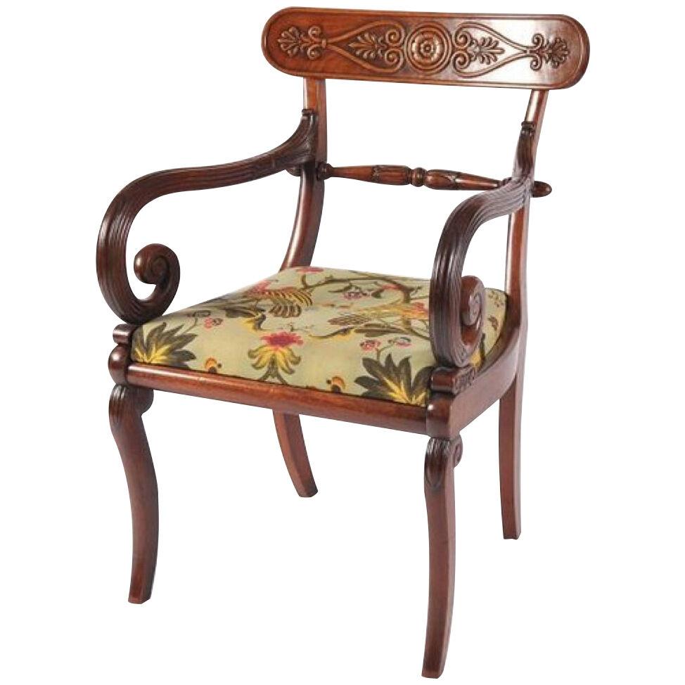 A fine French Empire period mahogany open arm chair