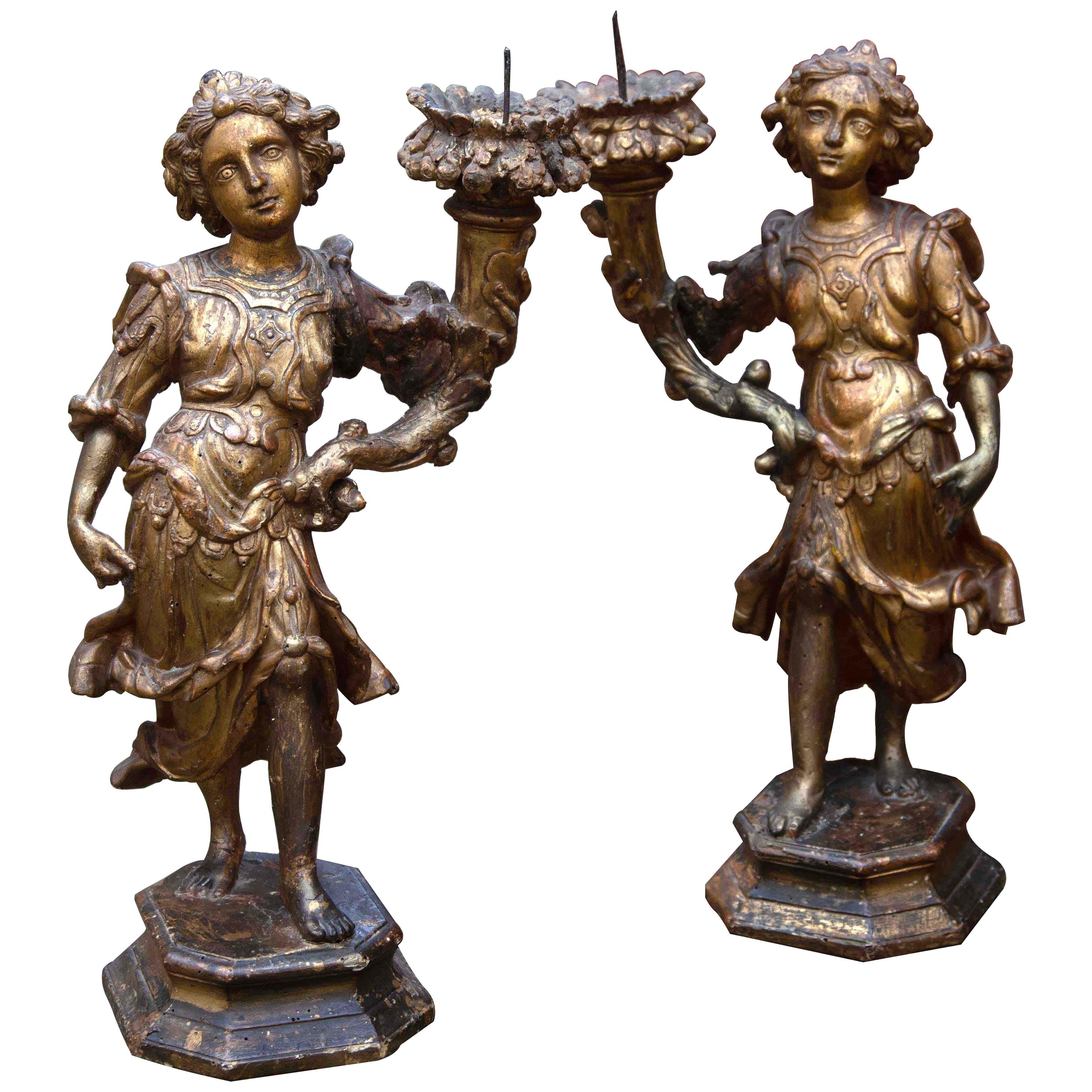 17th century Italian carved and giltwood figurative candlesticks