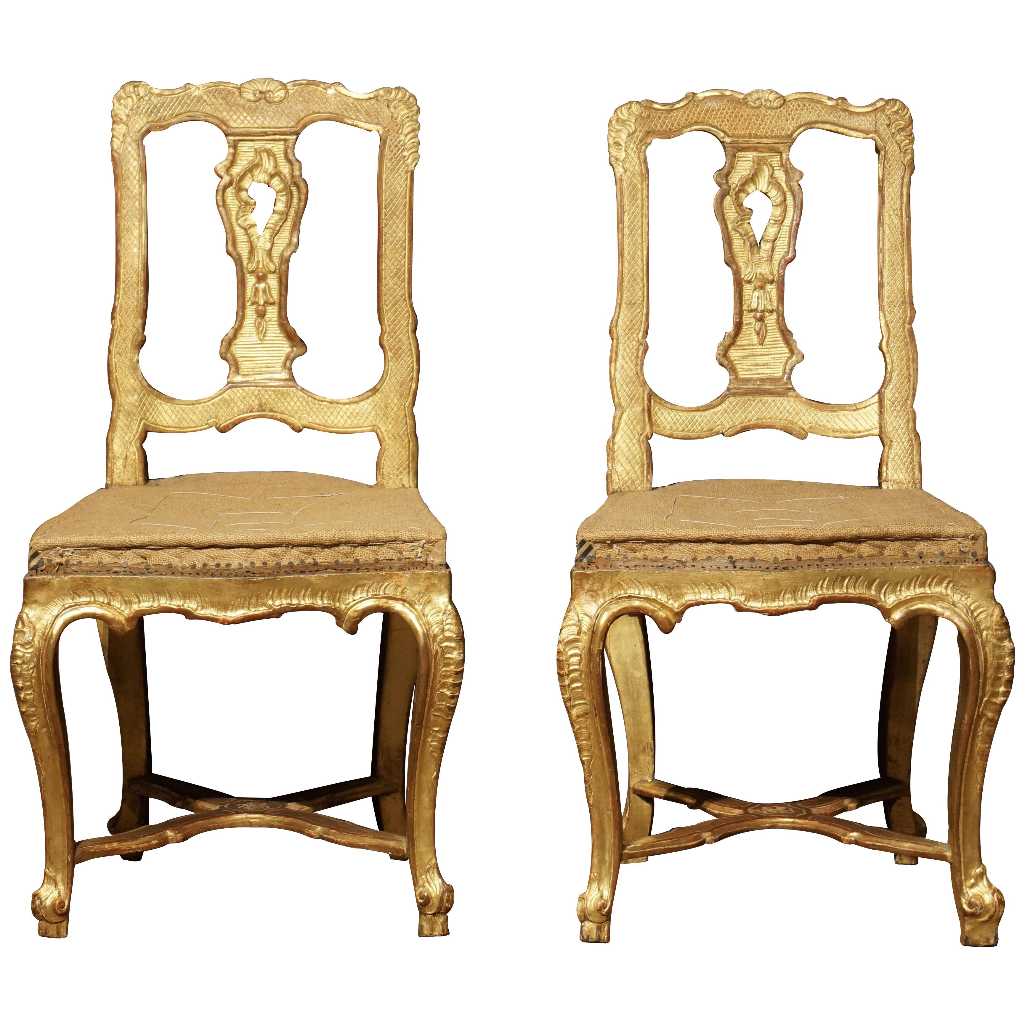 Pair of early 18th century French carved giltwood chairs