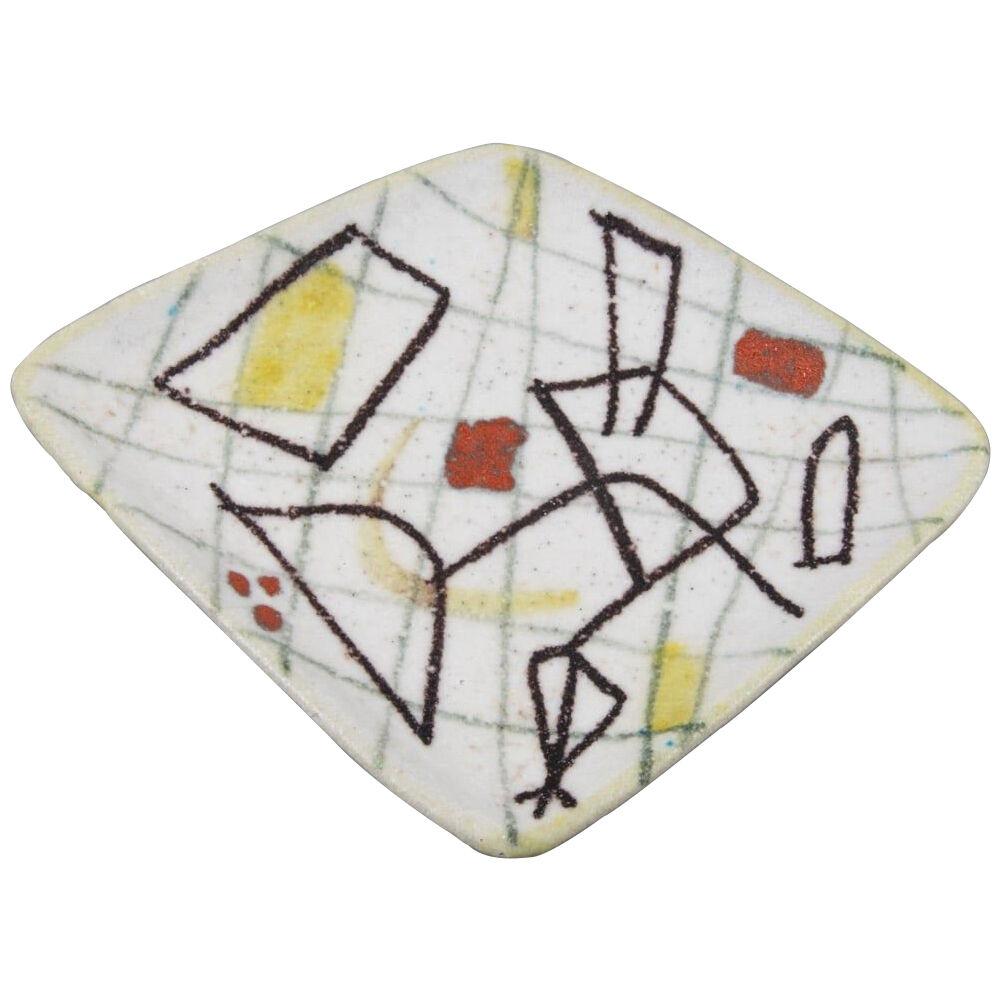 Freeform ceramic plate with abstract decor by Guido Gambone