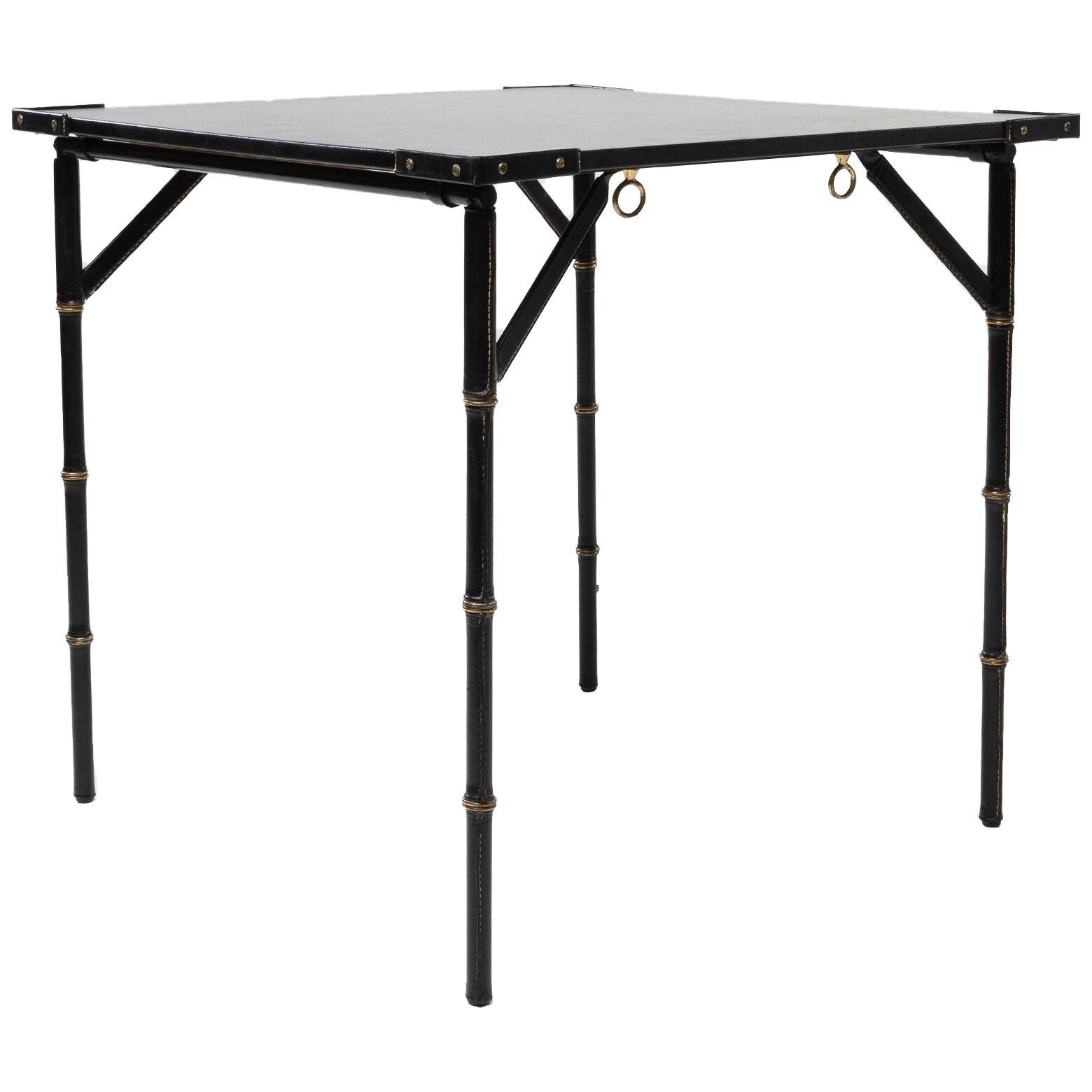 Bridge or games table with folding legs by Jacques Adnet – France