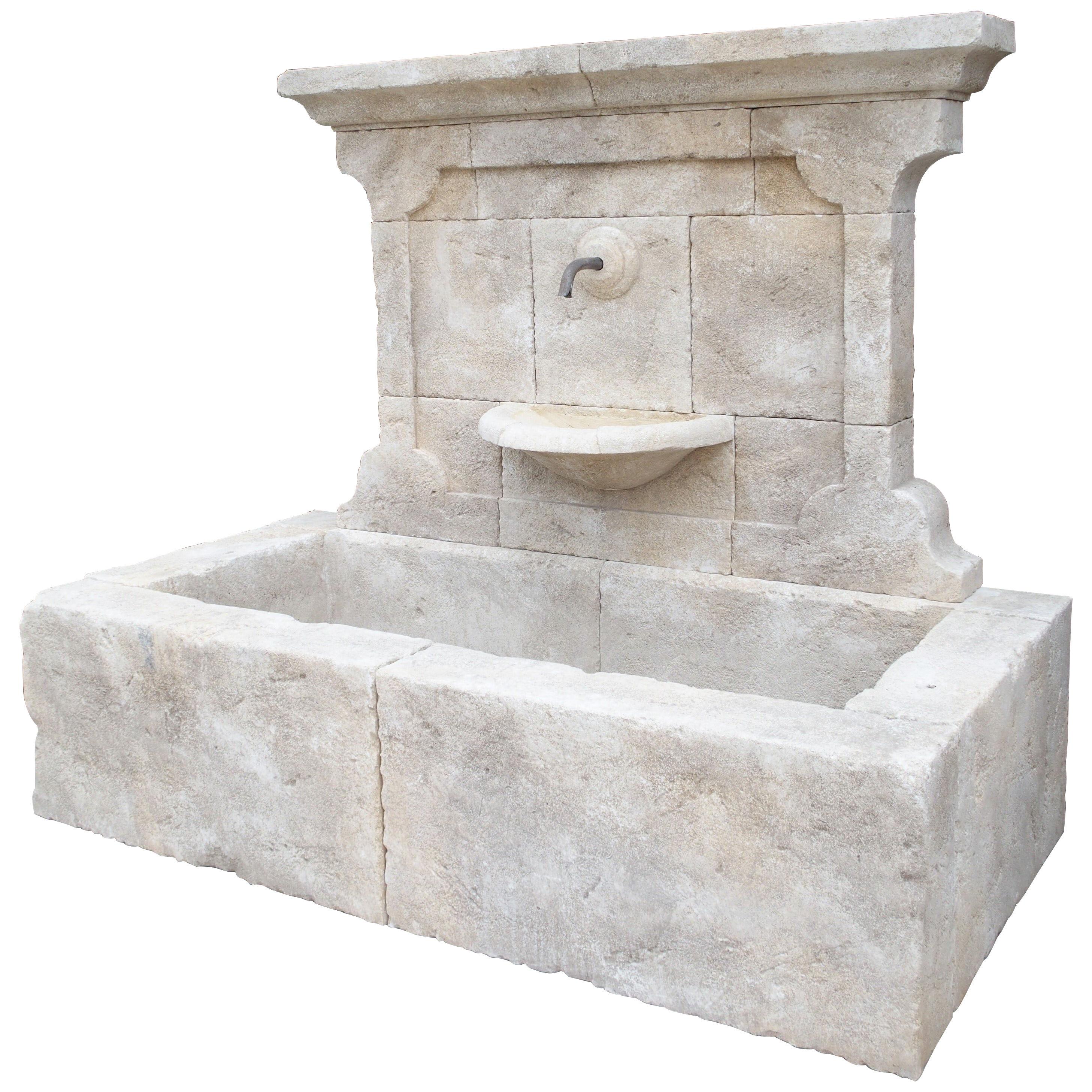 Carved French Stone Wall Fountain with Cast Iron Spout and Spill Bowl