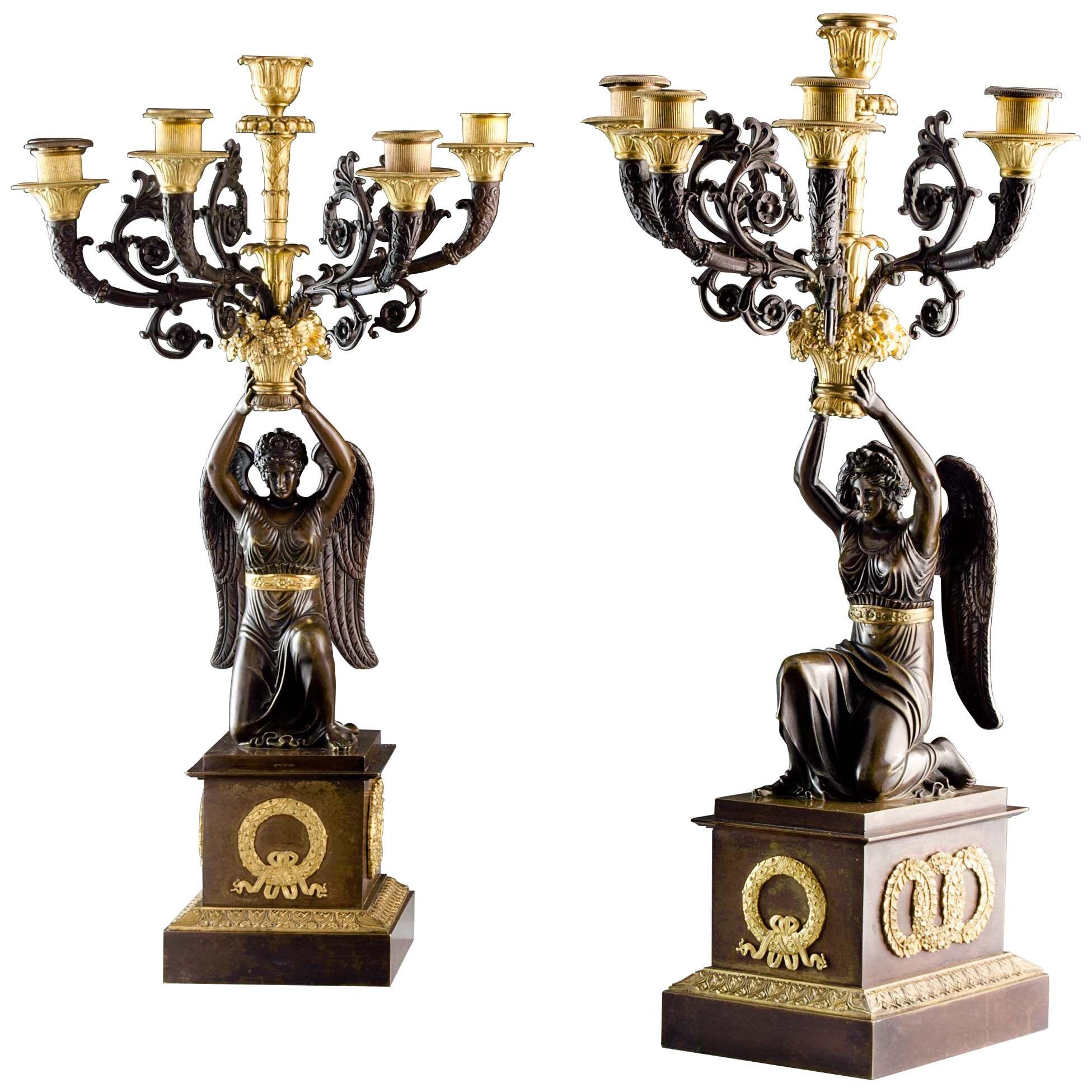 Pair of Empire Patinated and Gilt Bronze Five Arm Candelabra