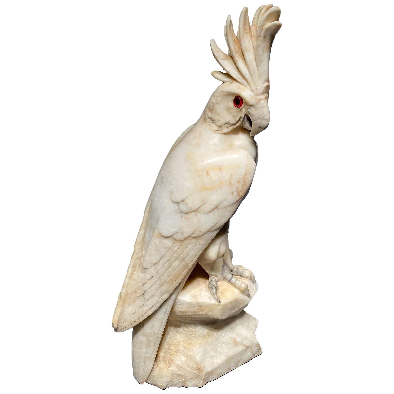 An cockatoo sculpture in alabaster