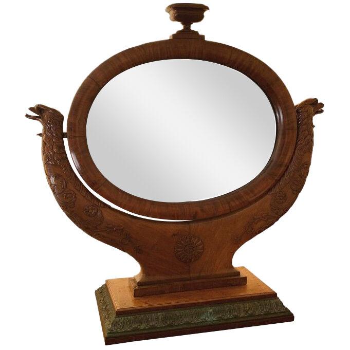 A 19th century French oval mahogany dressing mirror