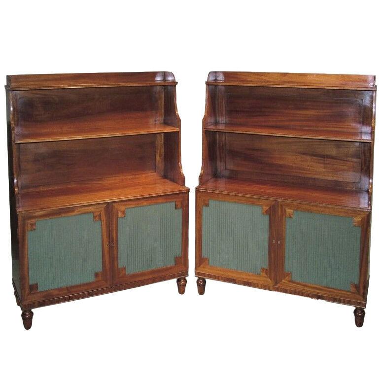 A pair of Regency period figured mahogany Waterfall Bookshelves.