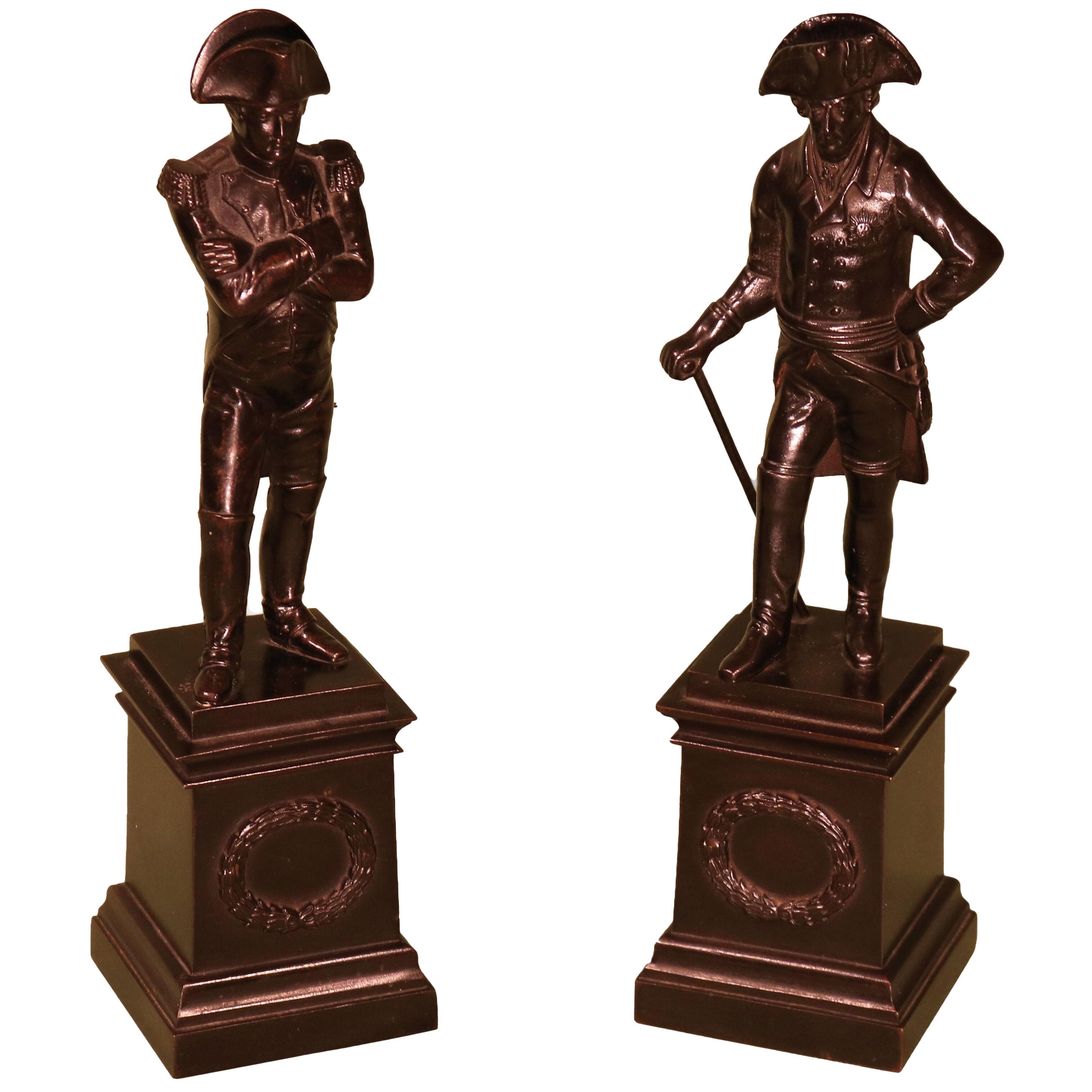 A pair of early 19th century iron figues of Napoleon and Frederick the Great