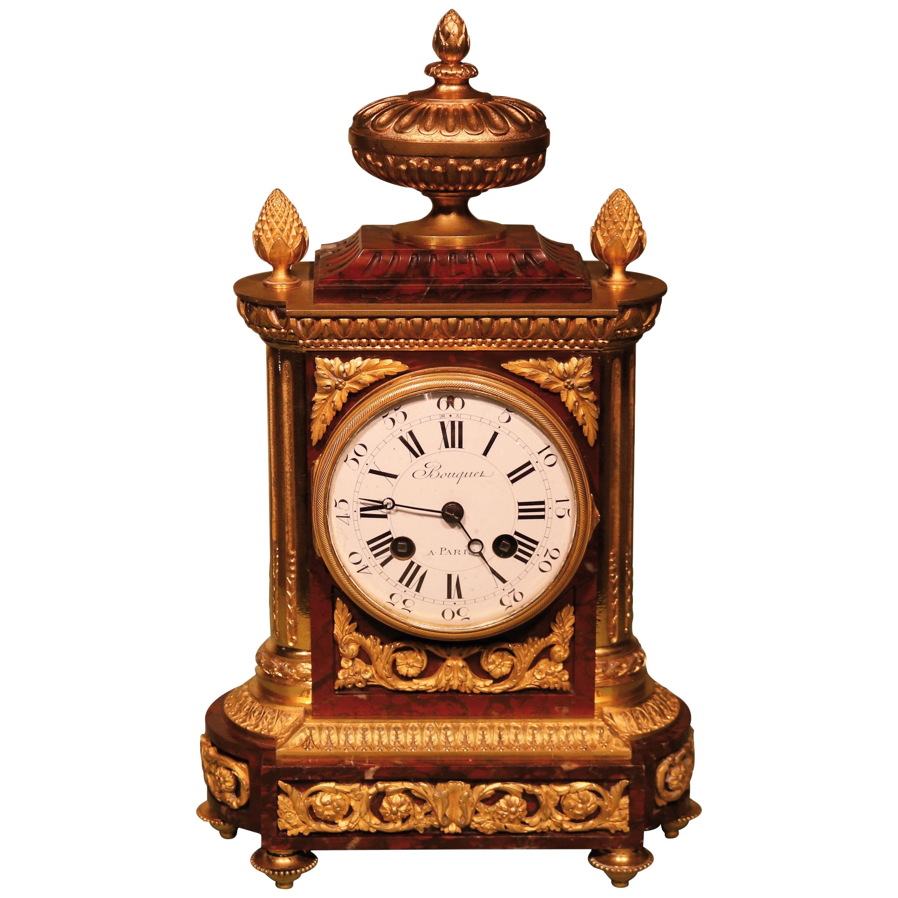 A mid 19th century Louis XVI style marble and bronze clock by Bouquet of Paris