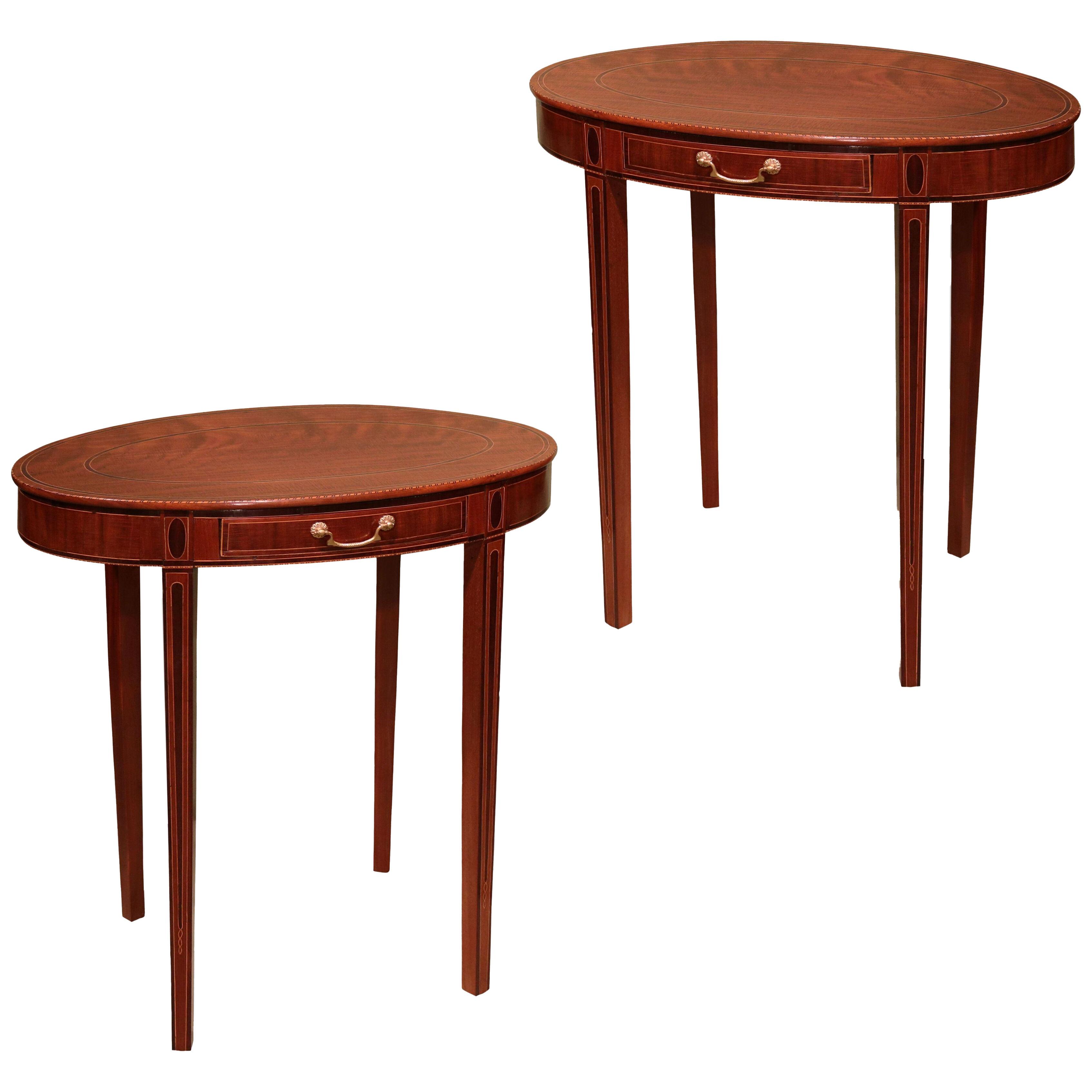 A pair of late 18th century Sheraton period mahogany oval occasional tables