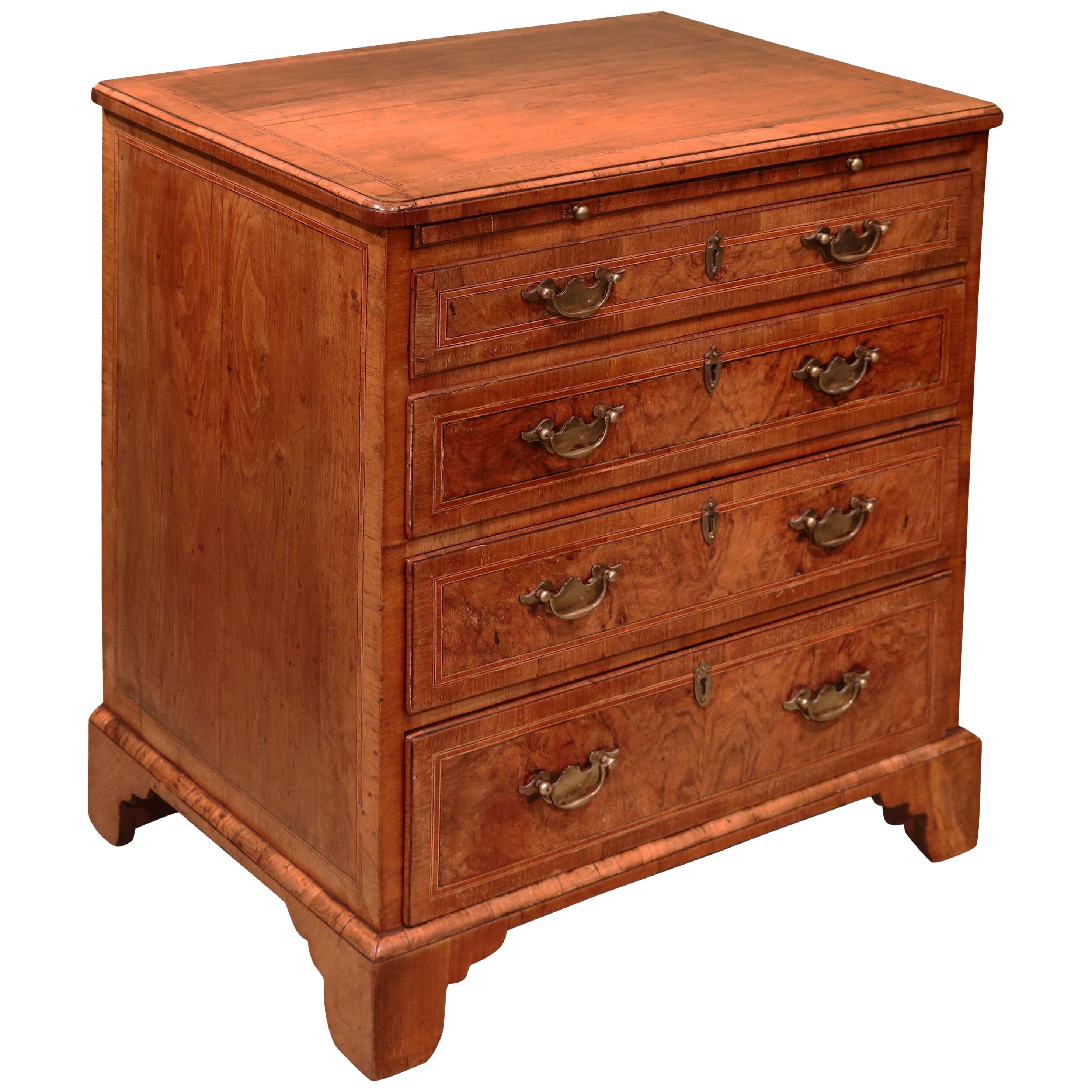 A small George II period walnut chest of drawers