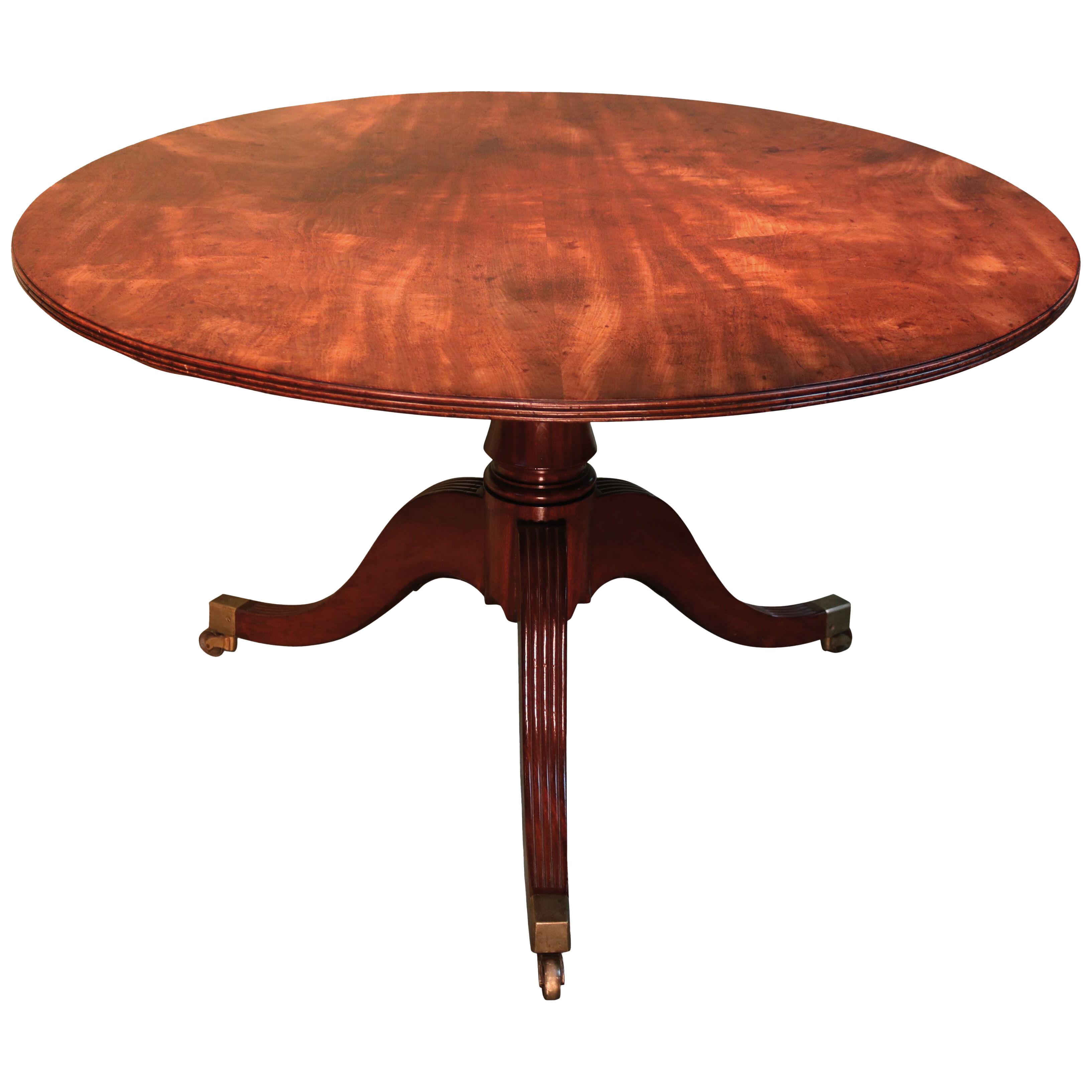An early 19th century Regency period mahogany circular breakfast table