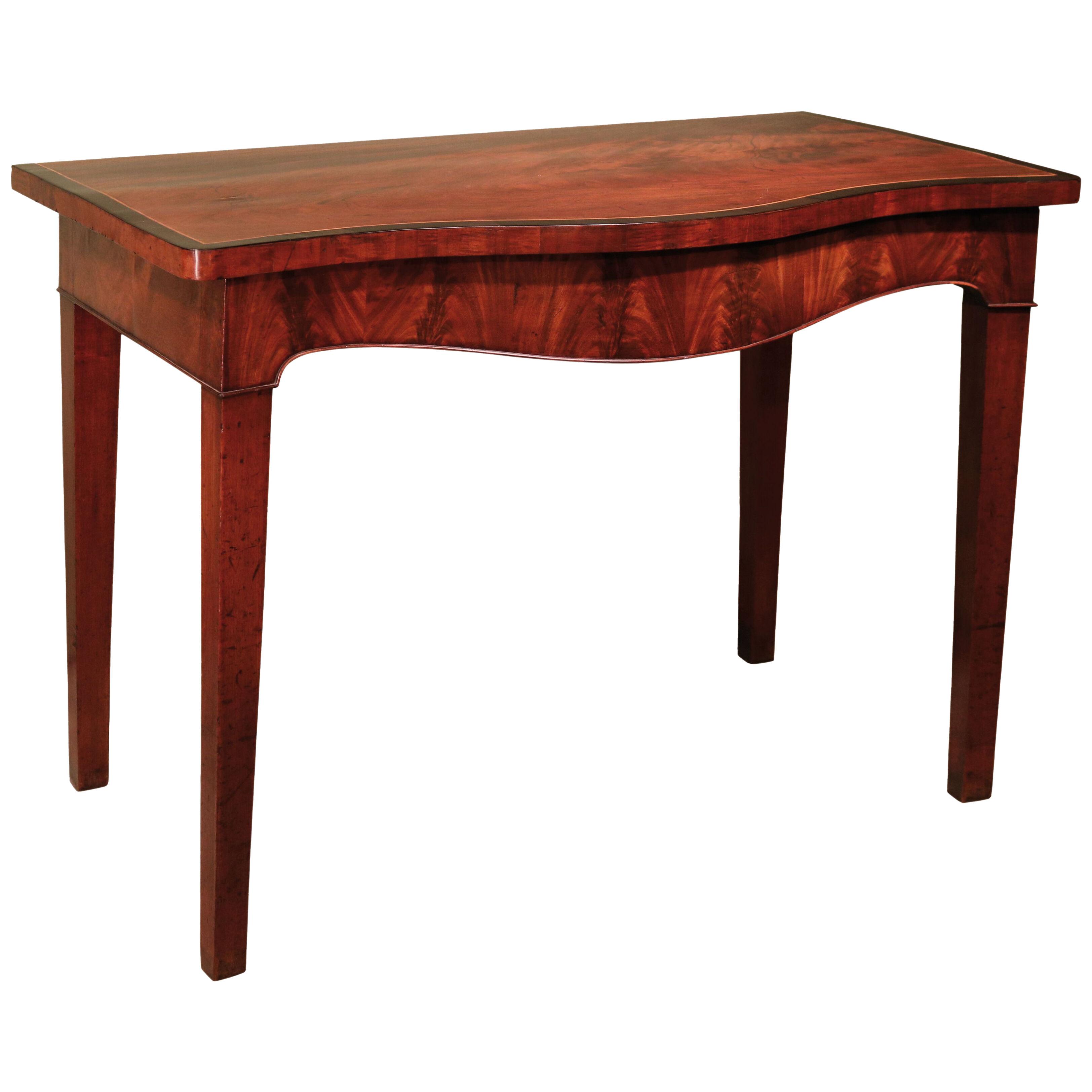 A mid 18th Century Mahogany Serpentine Side Table