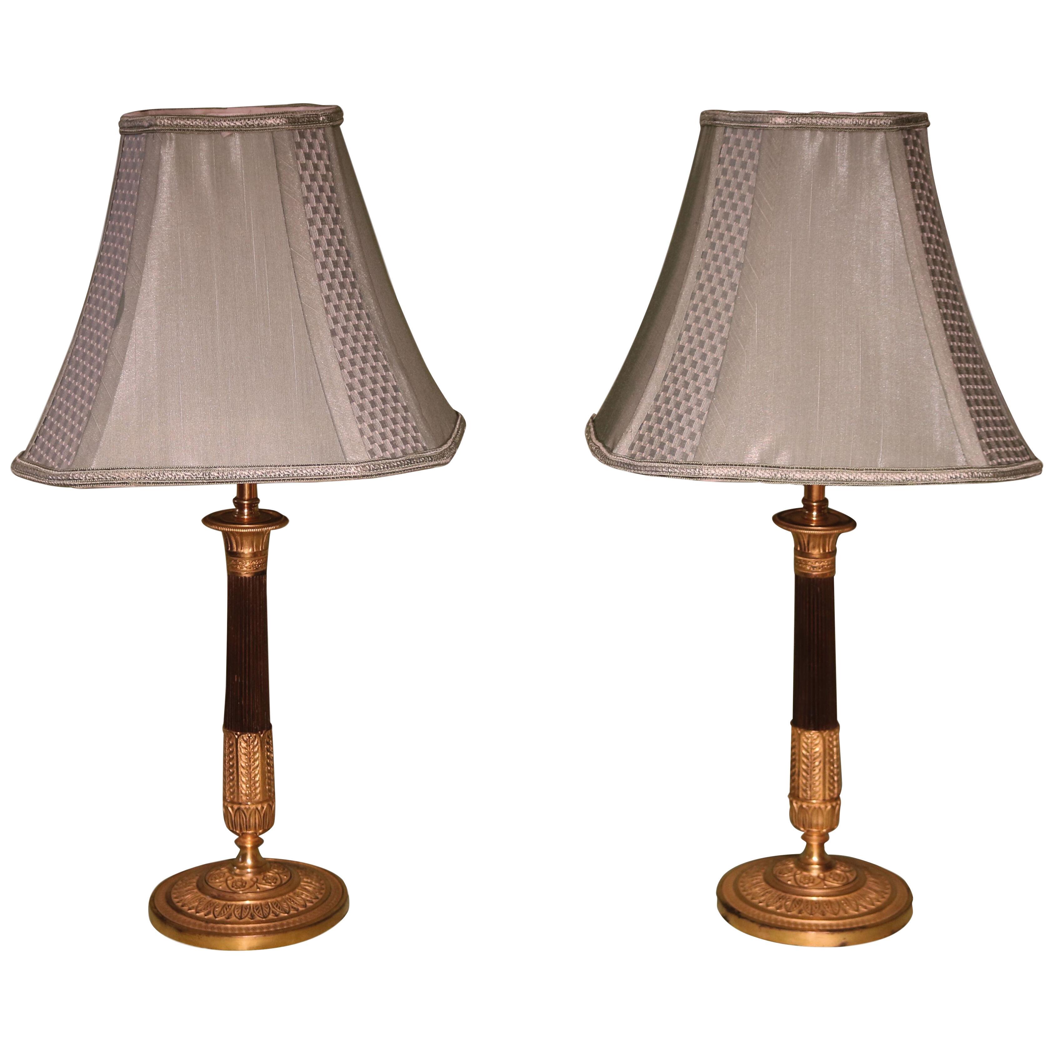 A Pair of 19th century bronze and ormolu candlestick lamps