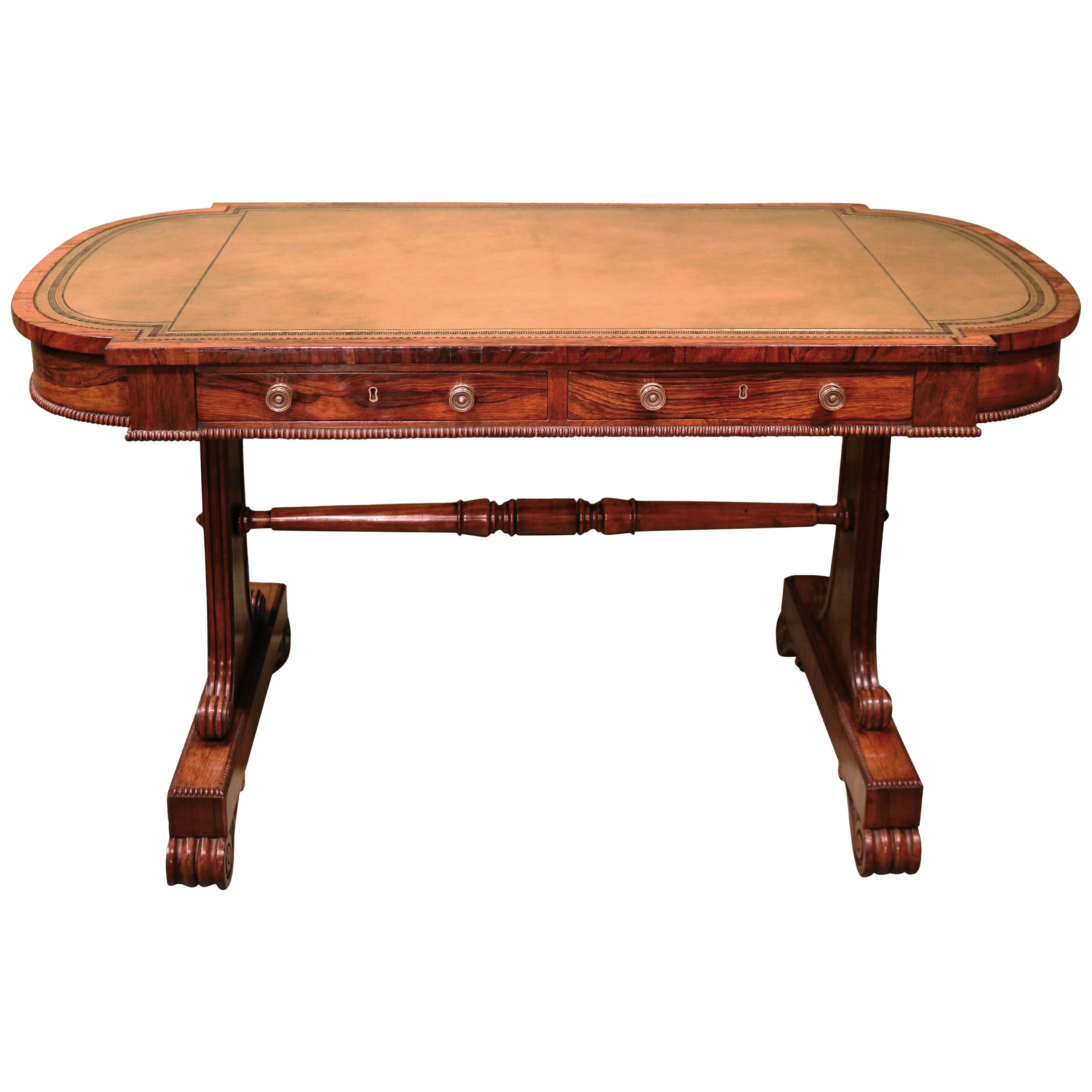 An eraly 19th century Regency period rosewood writing table