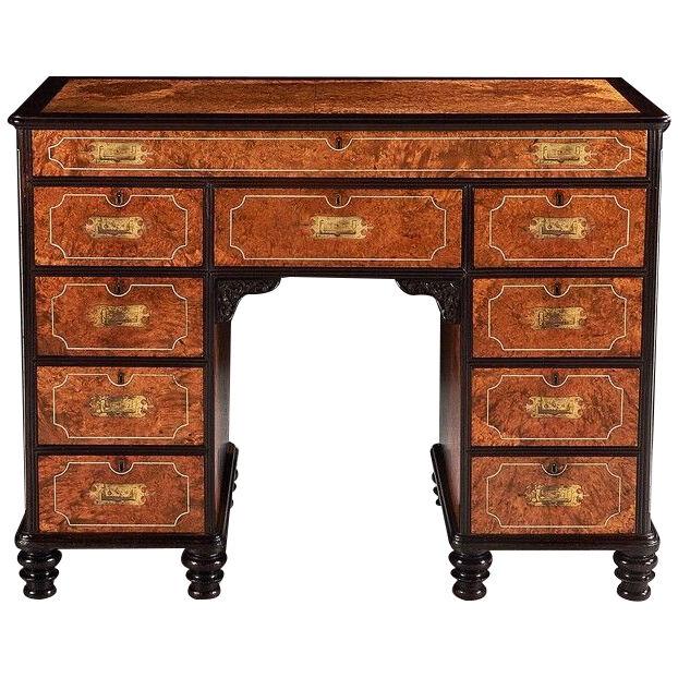 A Rare Chinese Export Amboyna and Ebony Campaign Kneehole Desk