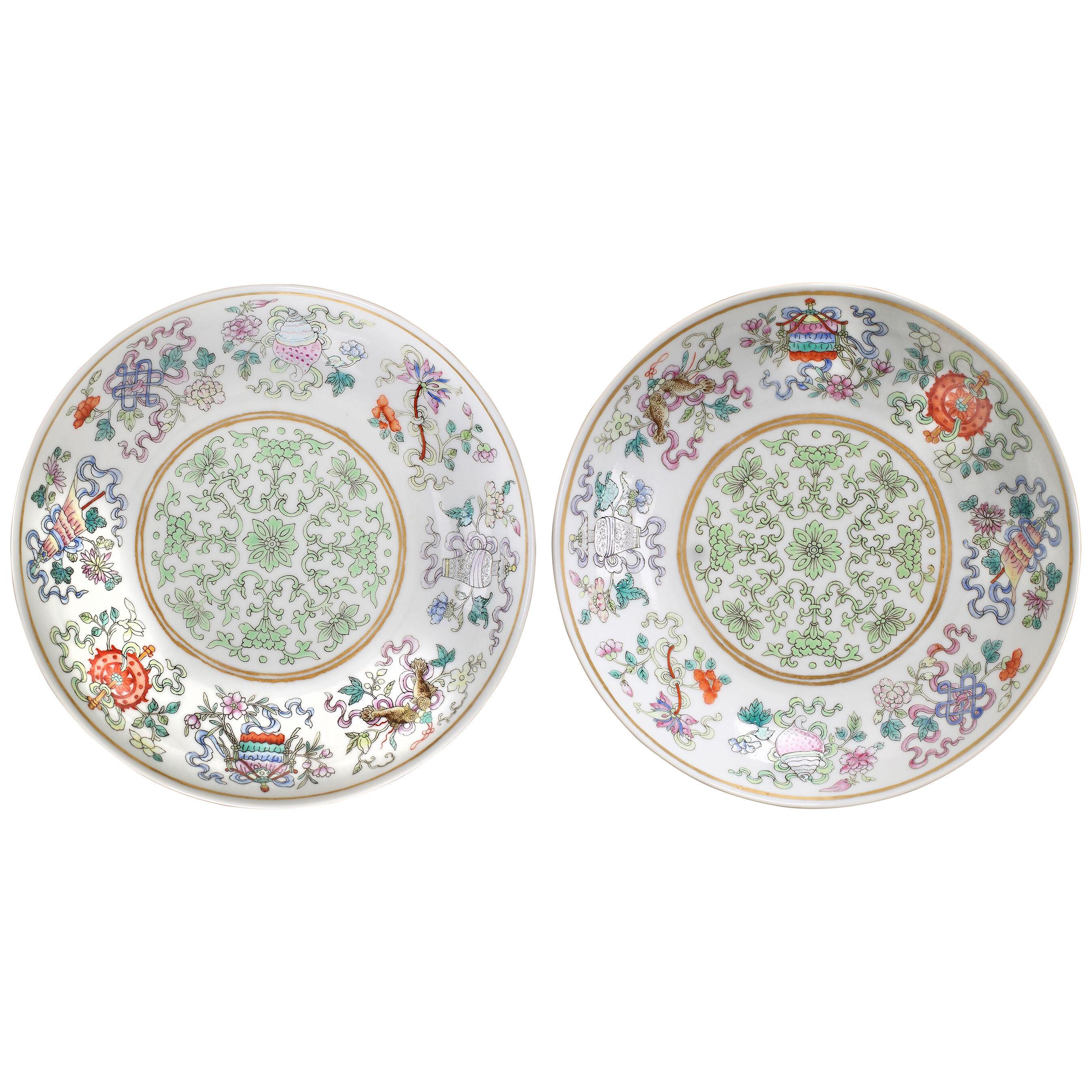 A pair of Chinese imperial porcelain famille rose enamelled fencai saucer dishes