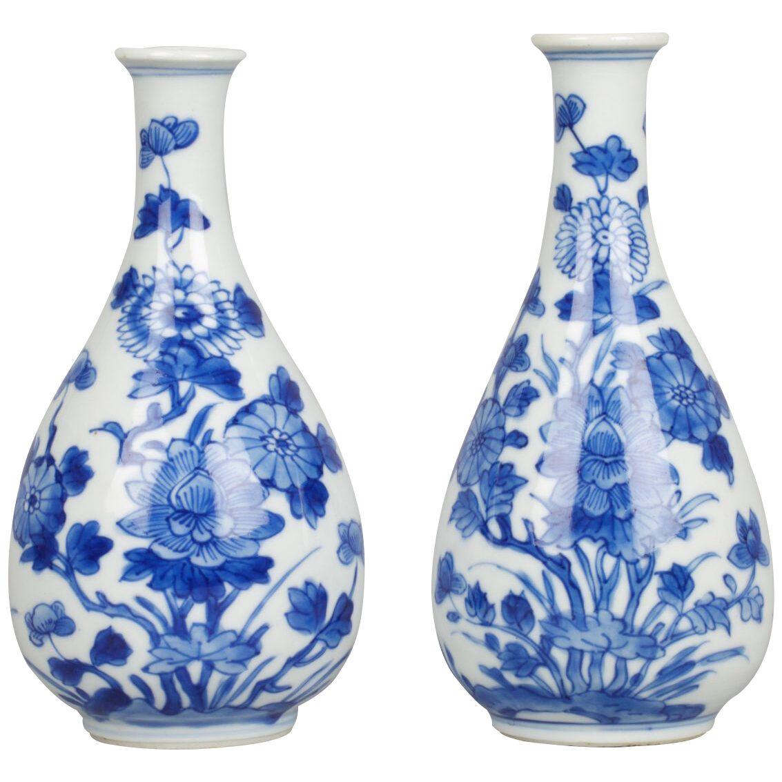 A pair of Chinese porcelain underglaze blue and white miniature bottle vases 
