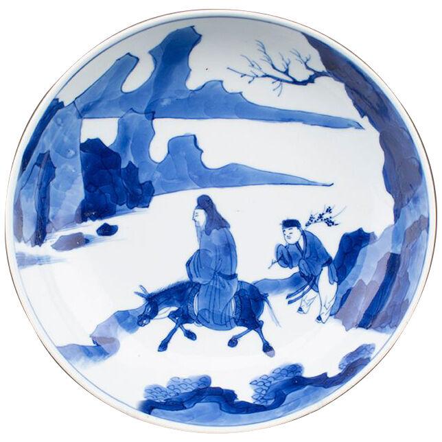 Chinese porcelain blue and white saucer dish with an equestrian scholar 